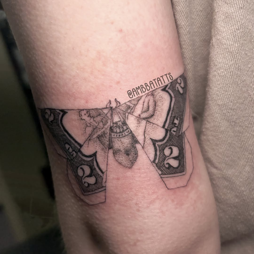 Money black and grey tattoo on the forearm by amber brady, Brunswick, Ohio