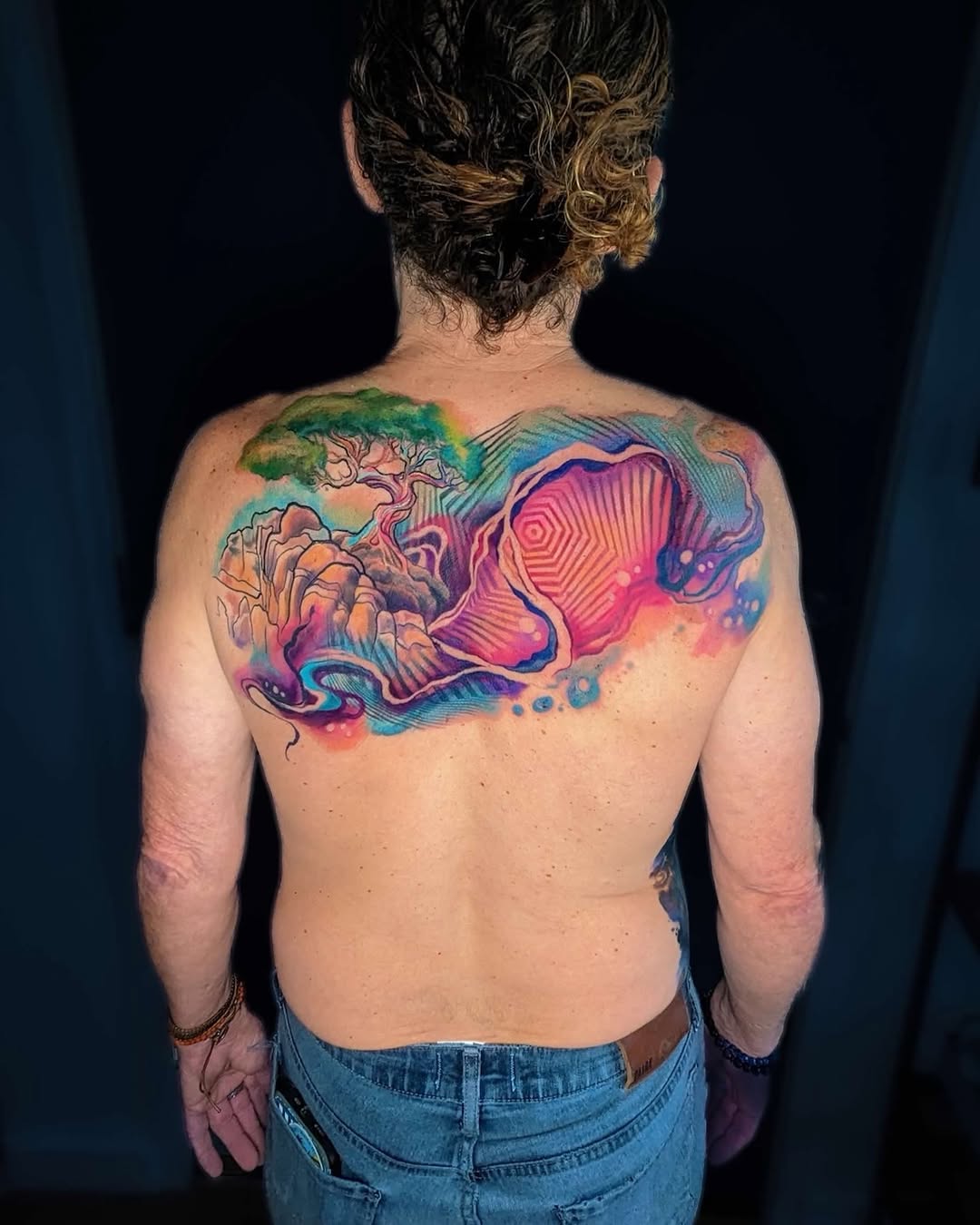 Abstract landscape with tree watercolor tattoo on the back by Amy Zager