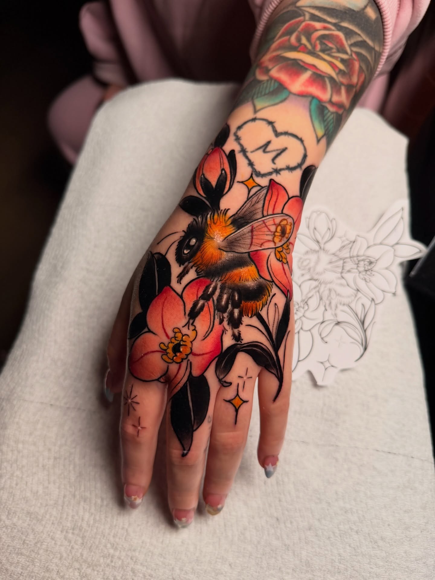 Bee and flowers American traditional tattoo on the hand by Robert Graye