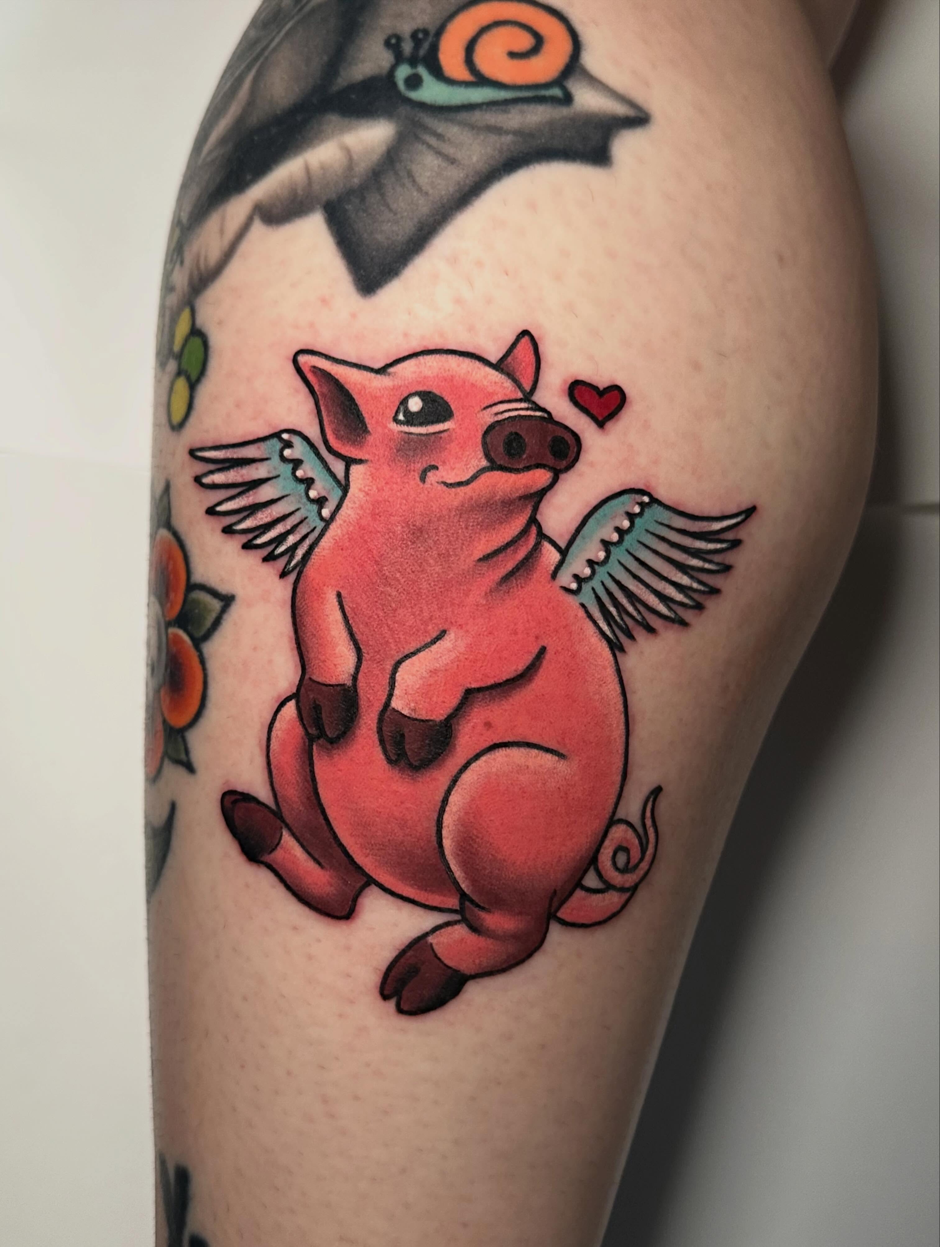 Pig with wings American traditional tattoo on the thigh by 🌿 Vicky Stoner 🌿