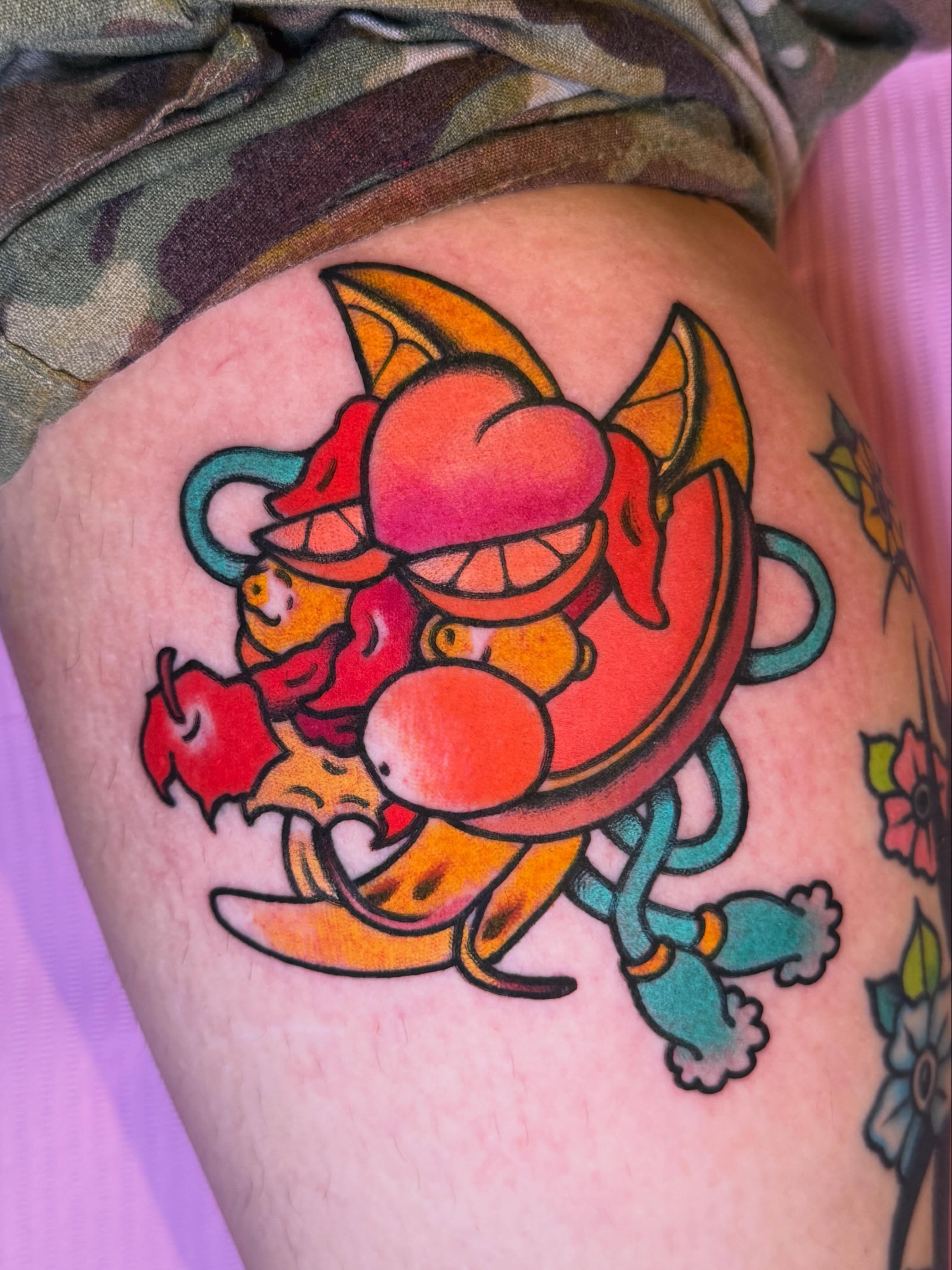 Octopus new school tattoo on the thigh by Cassie O'Neal DeBord