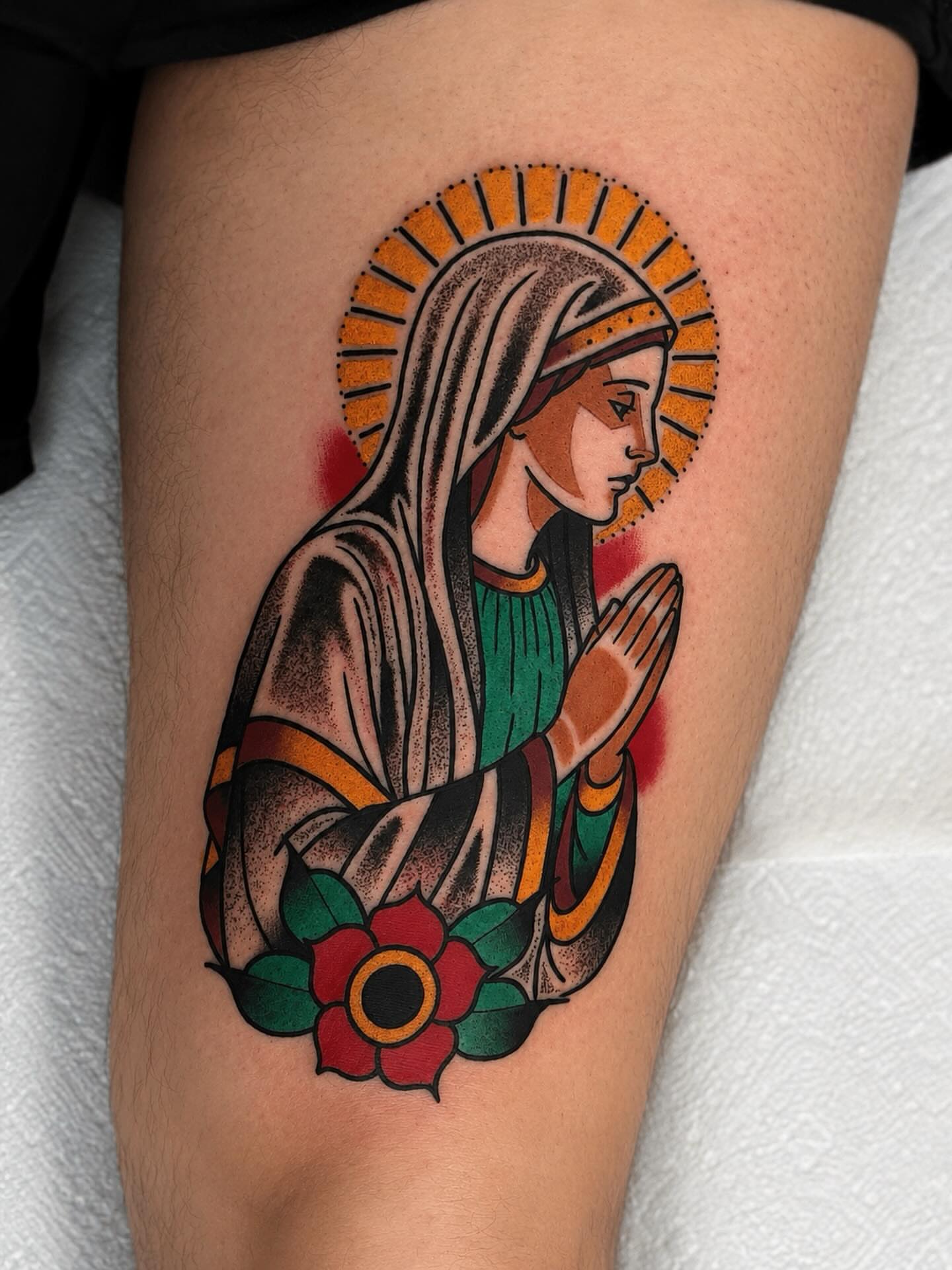 Praying woman American traditional tattoo on the thigh by Todd Showdown