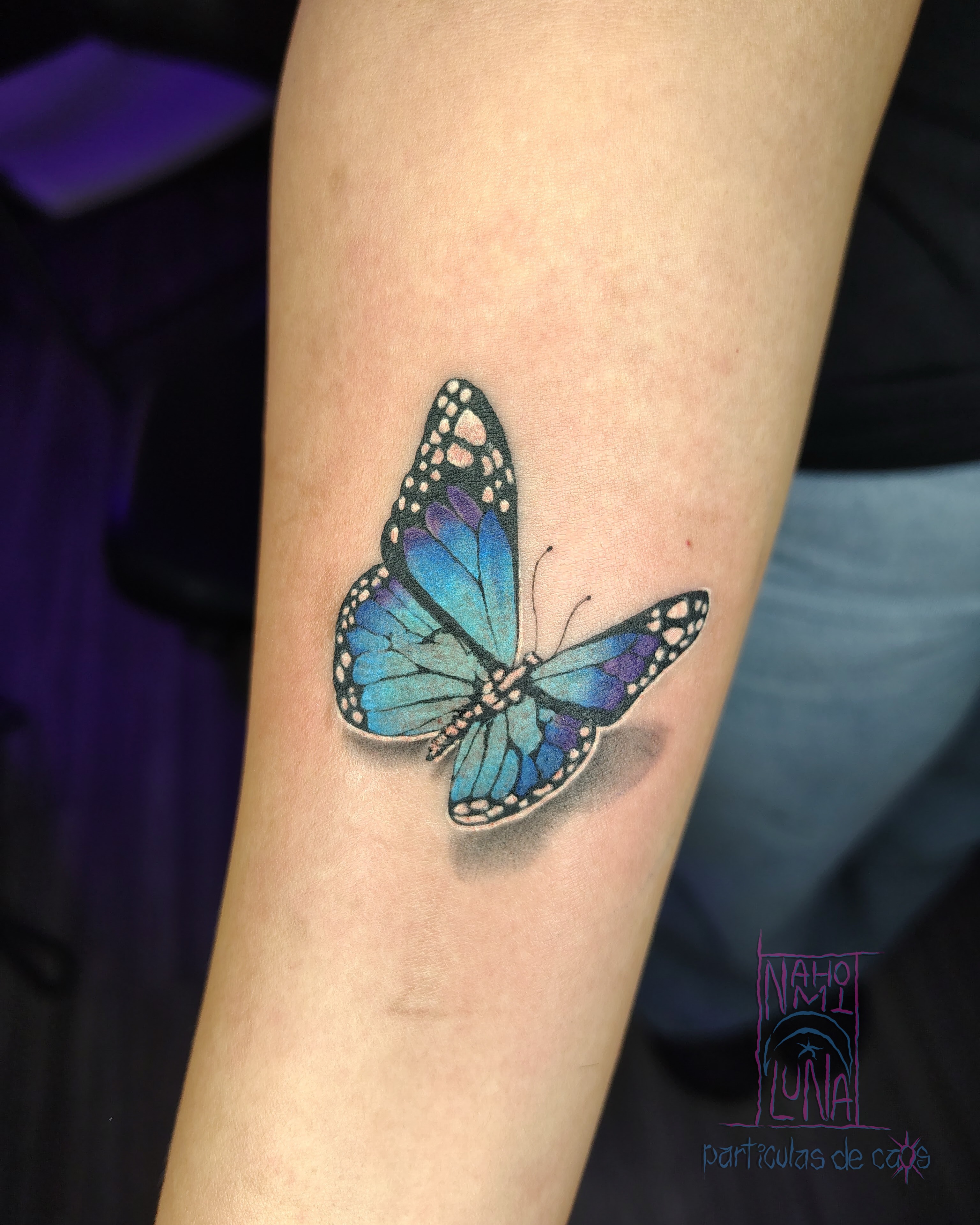 Blue butterfly dotwork tattoo on the forearm by Nahomi Luna - Memphis & Cordova Tattoo, Memphis, Tennessee