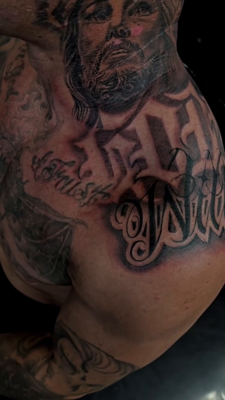 Jesus Christ and lettering realism tattoo by Richie Garcia, Hesperia, California
