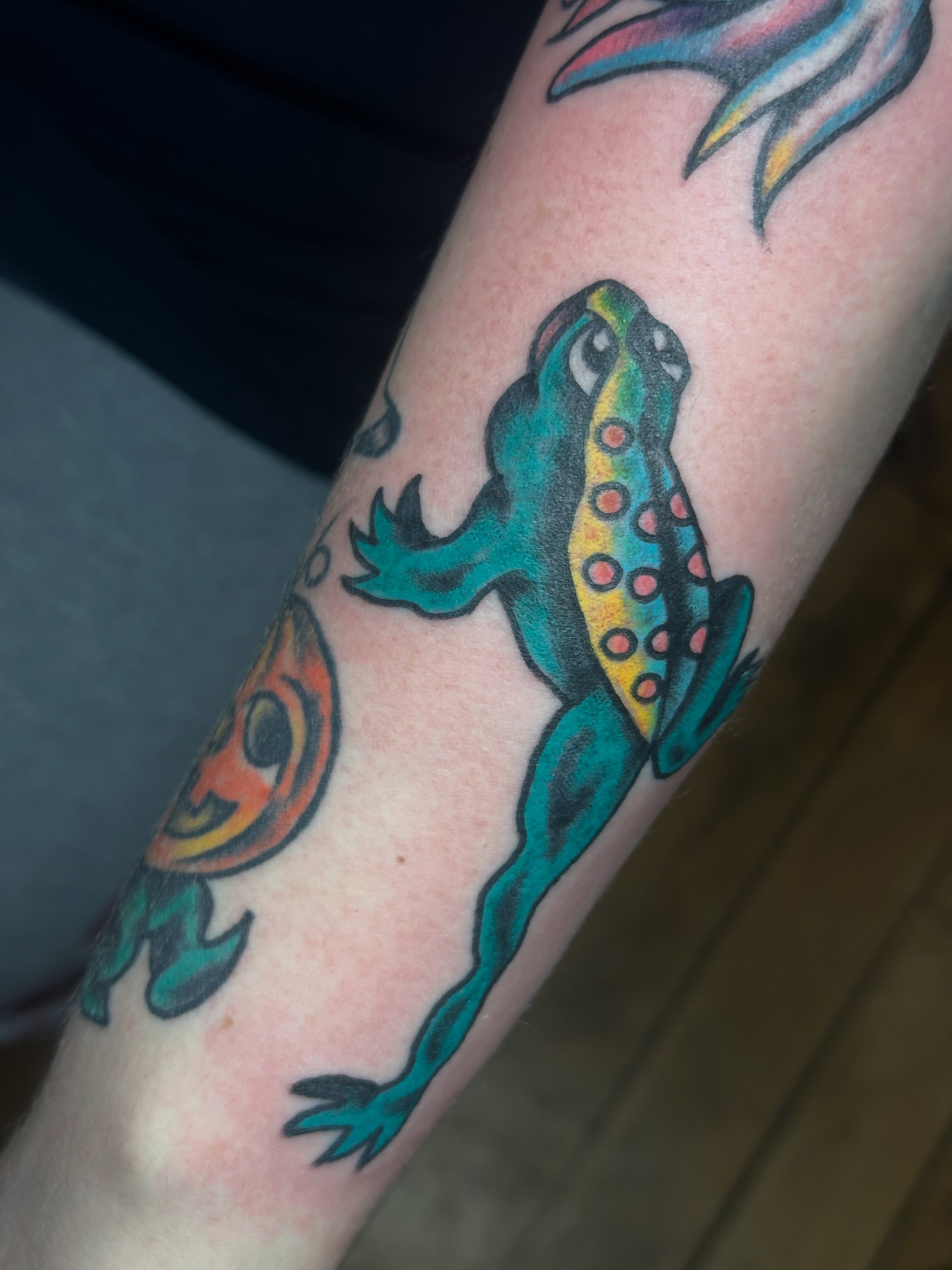 Frog American traditional tattoo on the forearm by Providence Tattooer