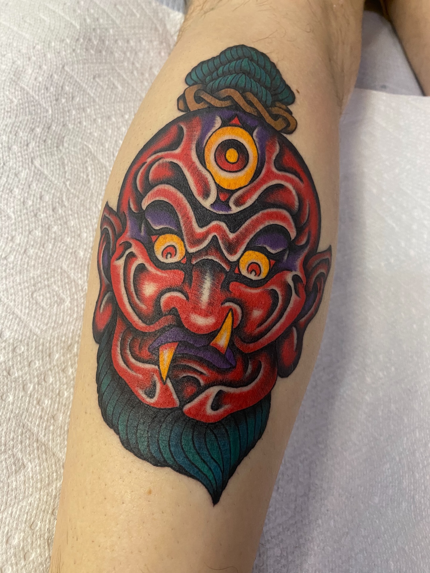 Demon mask japanese irezumi tattoo on the forearm by sean drennen