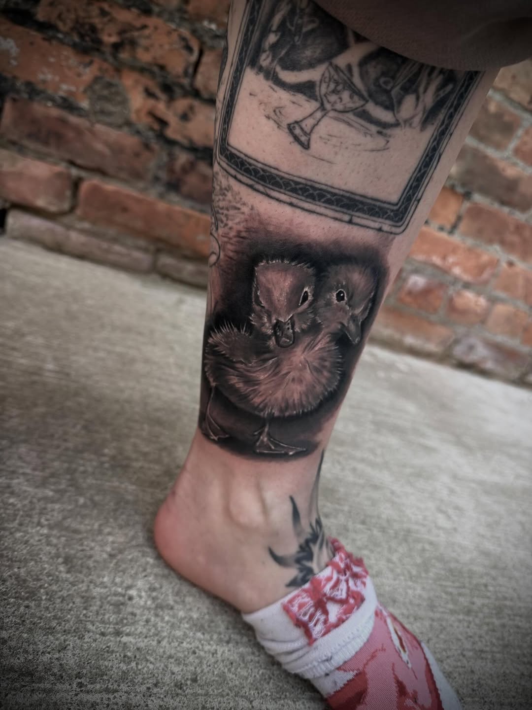 Two ducklings realism tattoo on the calf by Kodi Klo