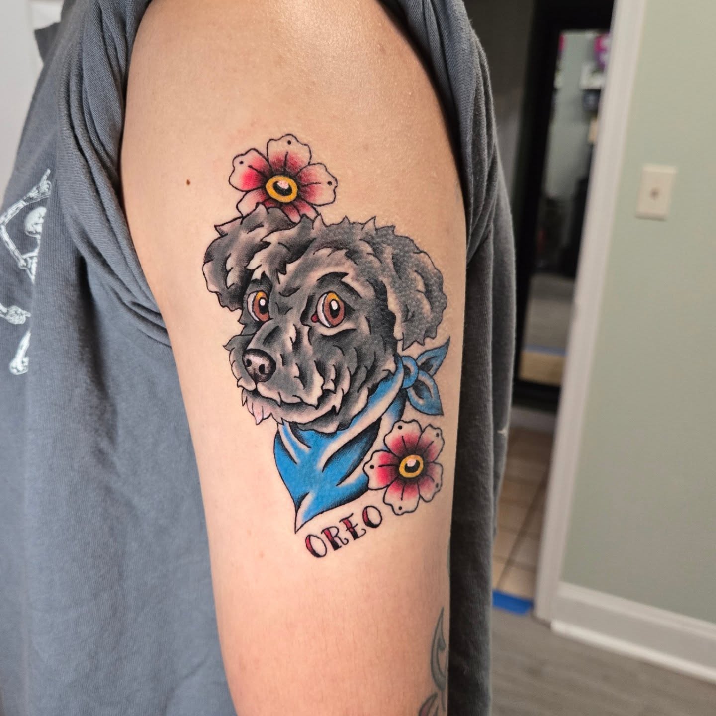 Dog with flowers American traditional tattoo on the forearm by Matt Page