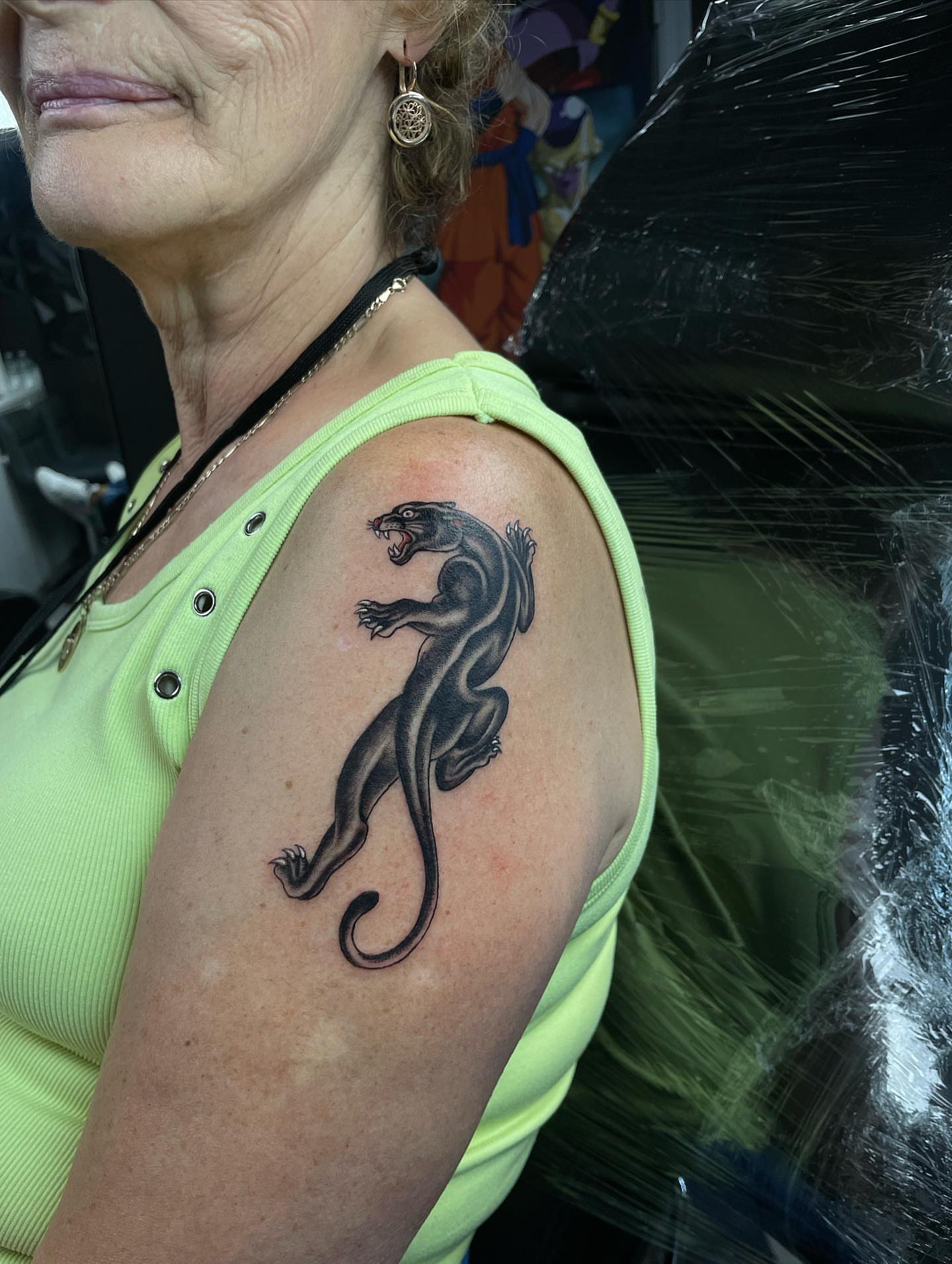 Panther black and grey tattoo on the shoulder by Nikko