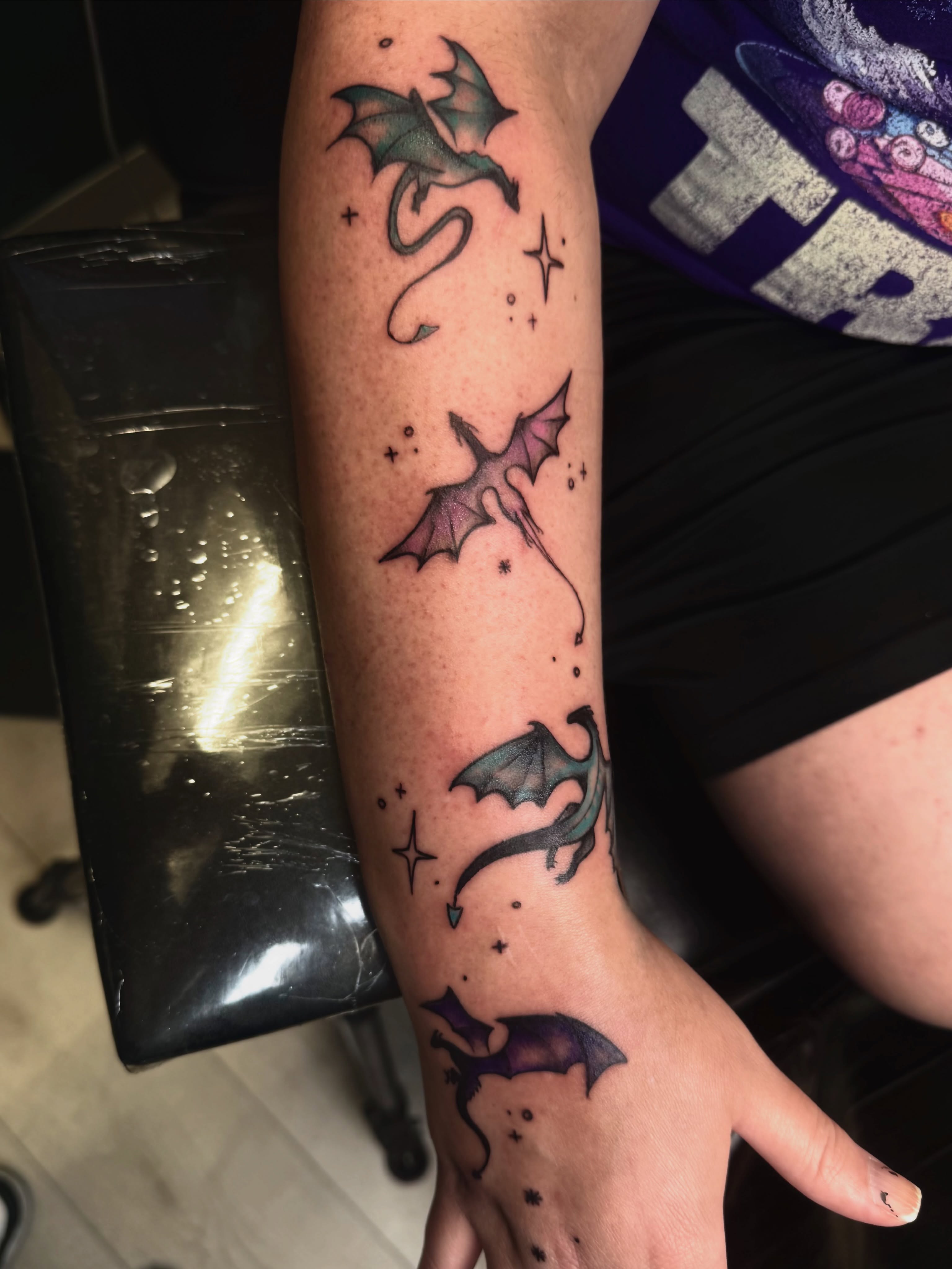 Dragons dotwork tattoo on the forearm by Jennifer Contreras