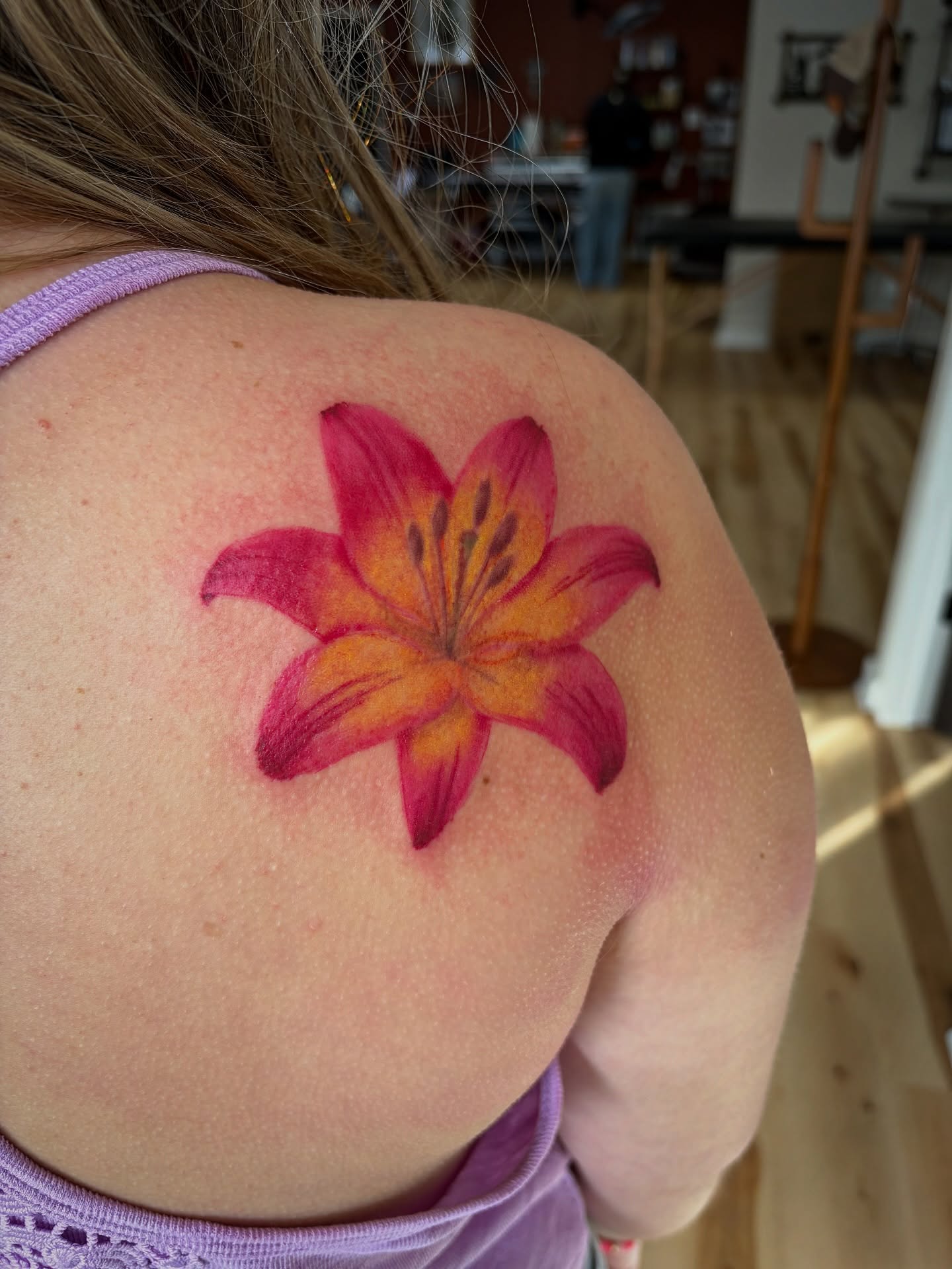 Lily realism tattoo on the shoulder by Francesca Siwa