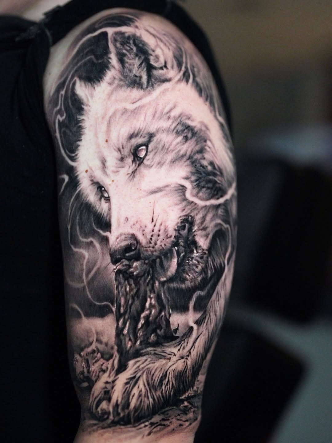 Wolf head with lightning realism tattoo on the forearm by Nico Perez