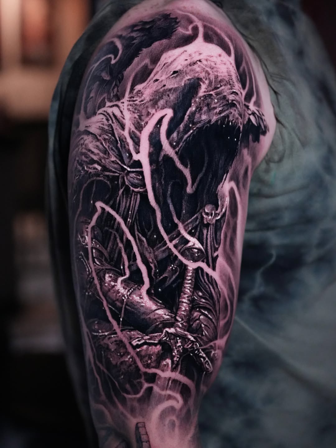 Grim reaper with sword realism tattoo on the upper arm by Nico Perez