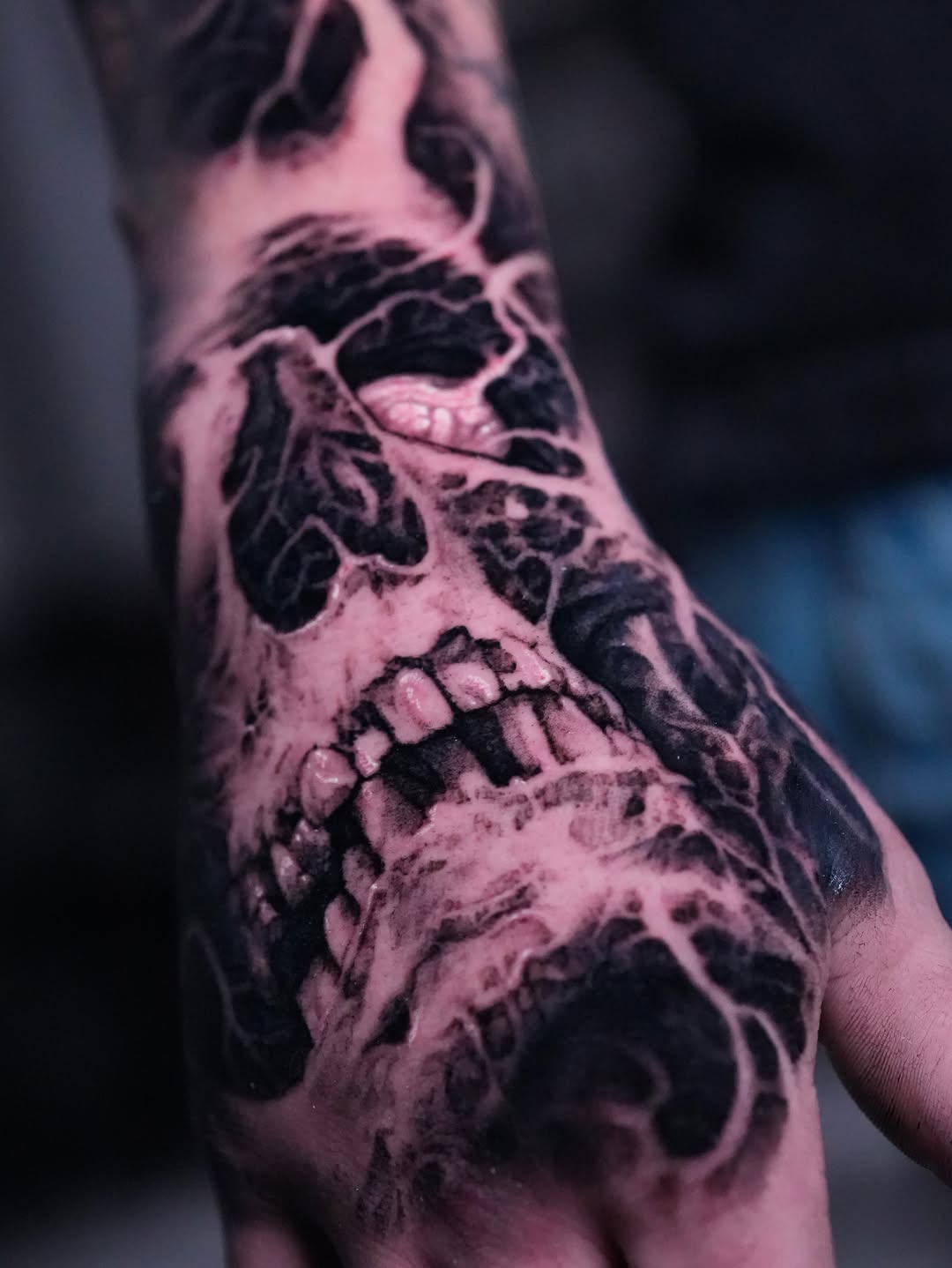 Skull with decaying flesh realism tattoo on the forearm by Nico Perez