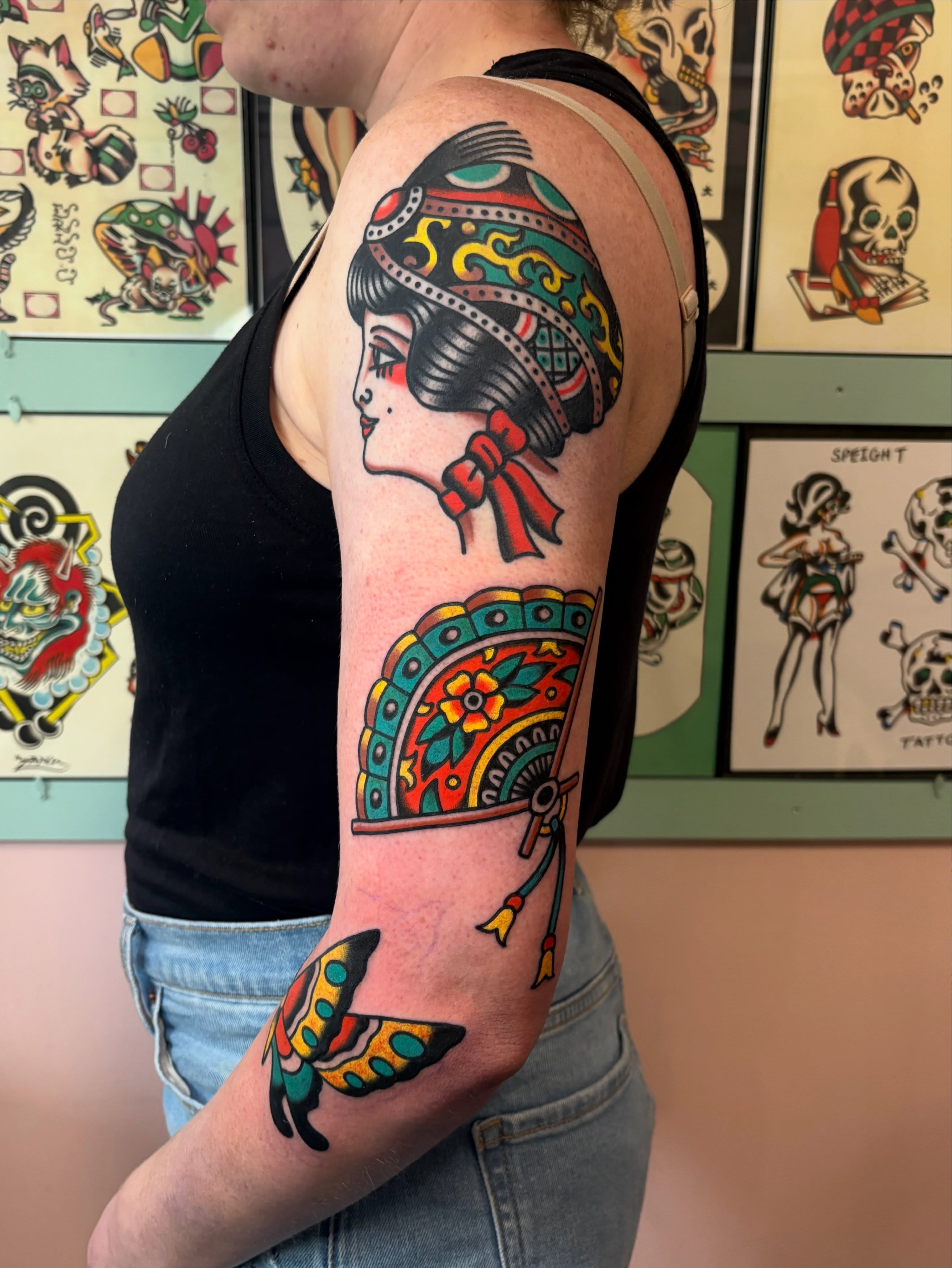 Woman with traditional headdress American traditional tattoo on the forearm by Traditional Tattooing