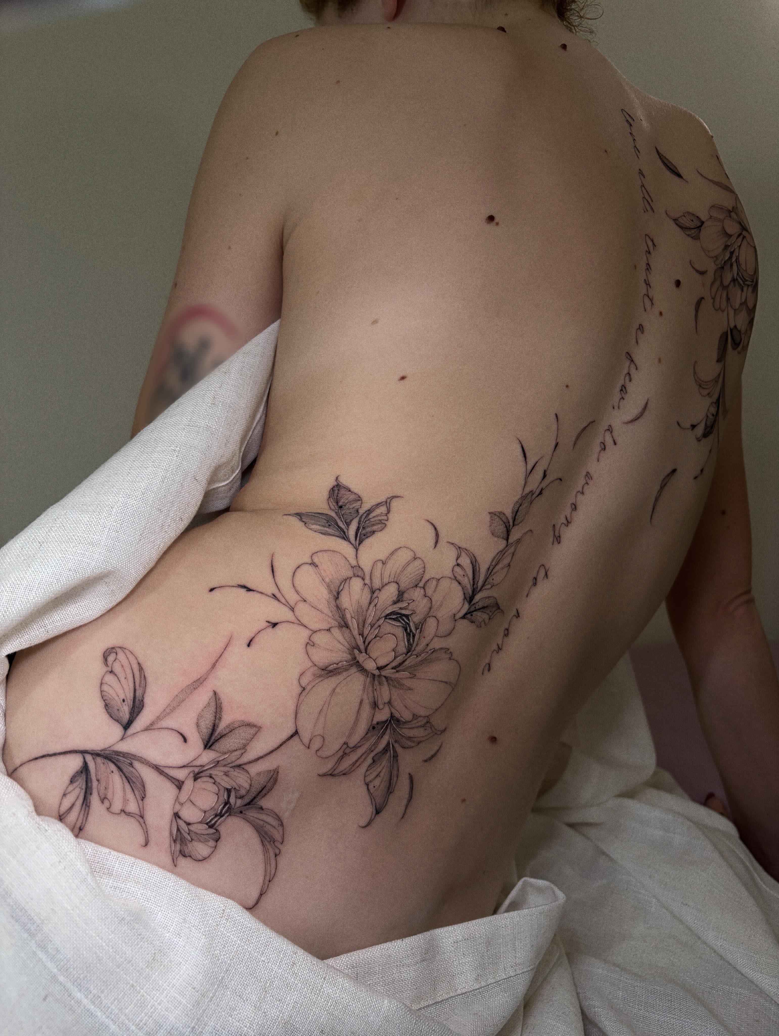 Peony flowers black and grey tattoo on the ribs by Justene Renee 🖤 Fine Line Tattoo Artist