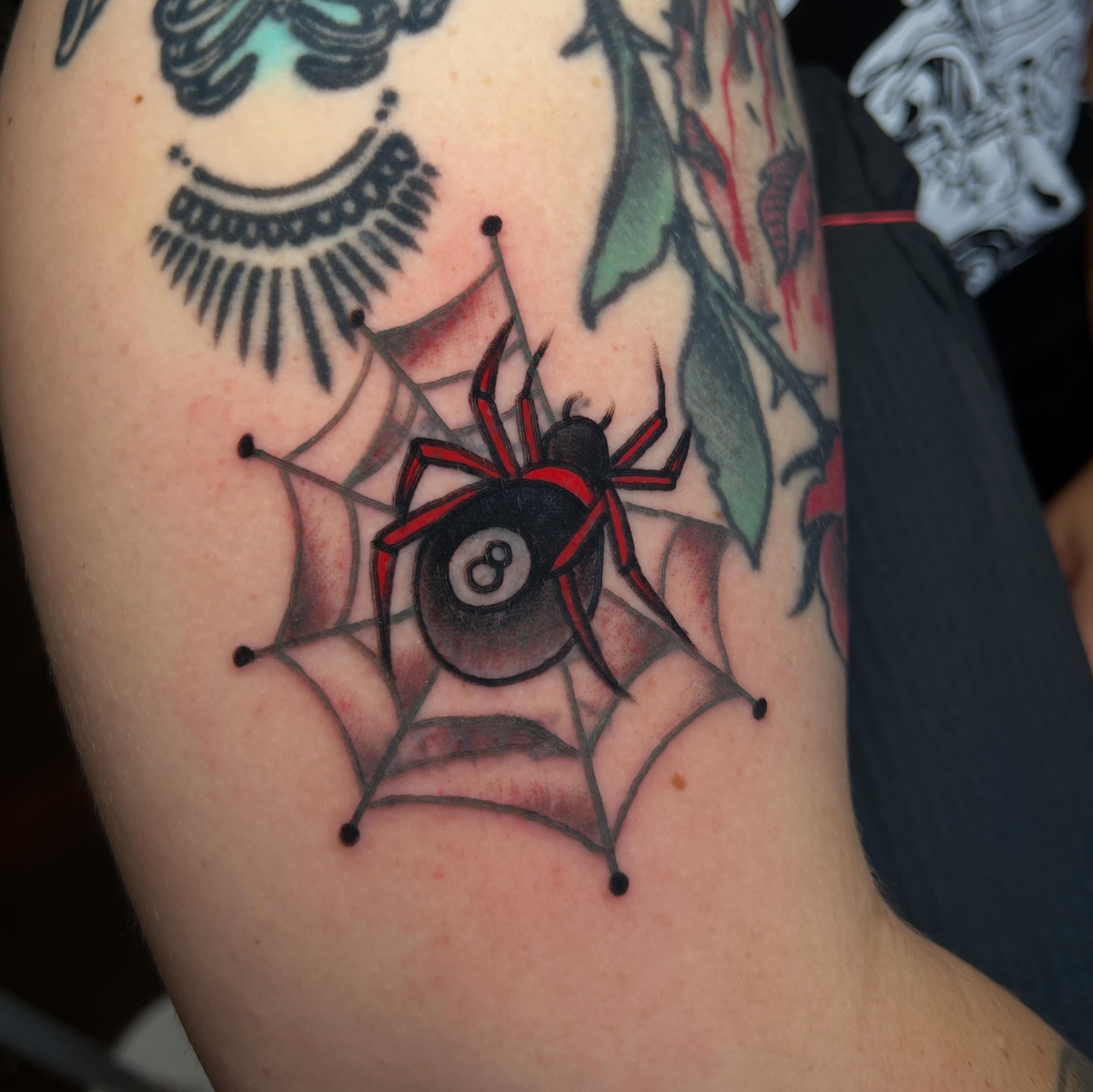 Spider and eight ball American traditional tattoo on the upper arm by Mat Helton, Fairborn, Ohio