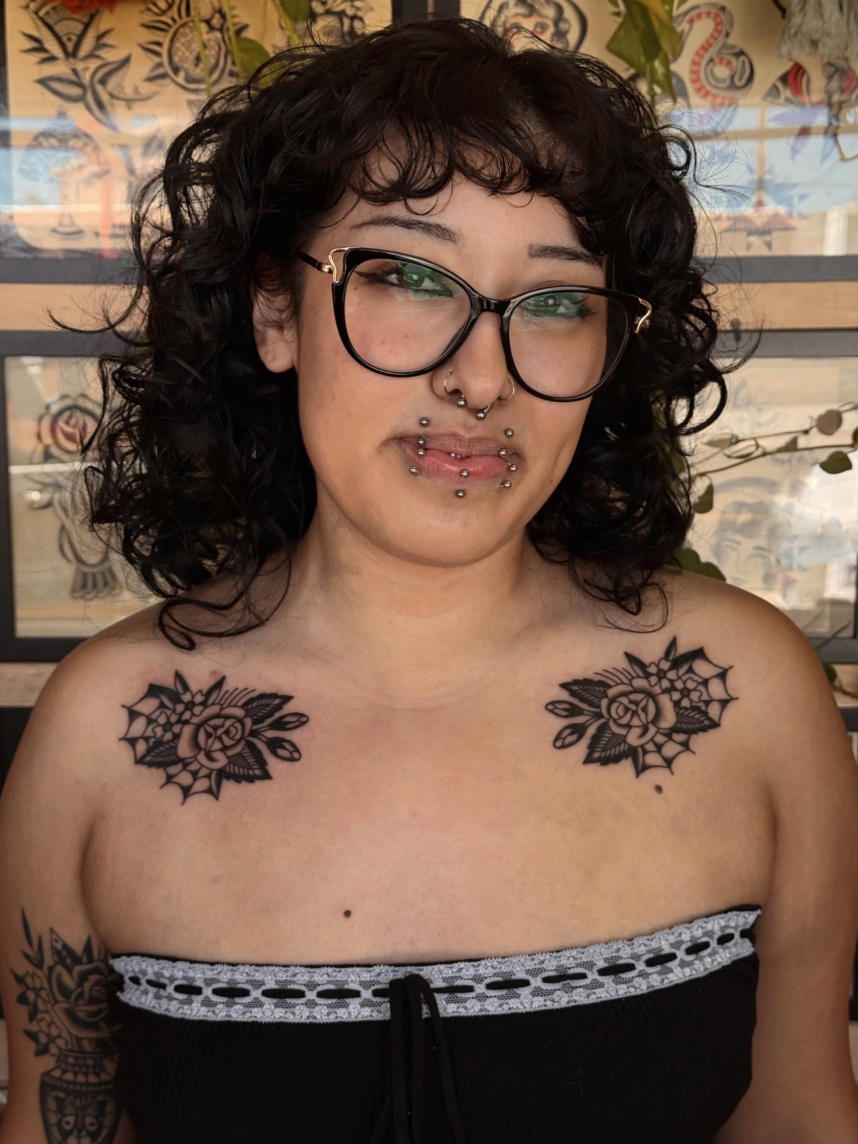 Roses black and grey tattoo on the chest by Bridgette Carberry
