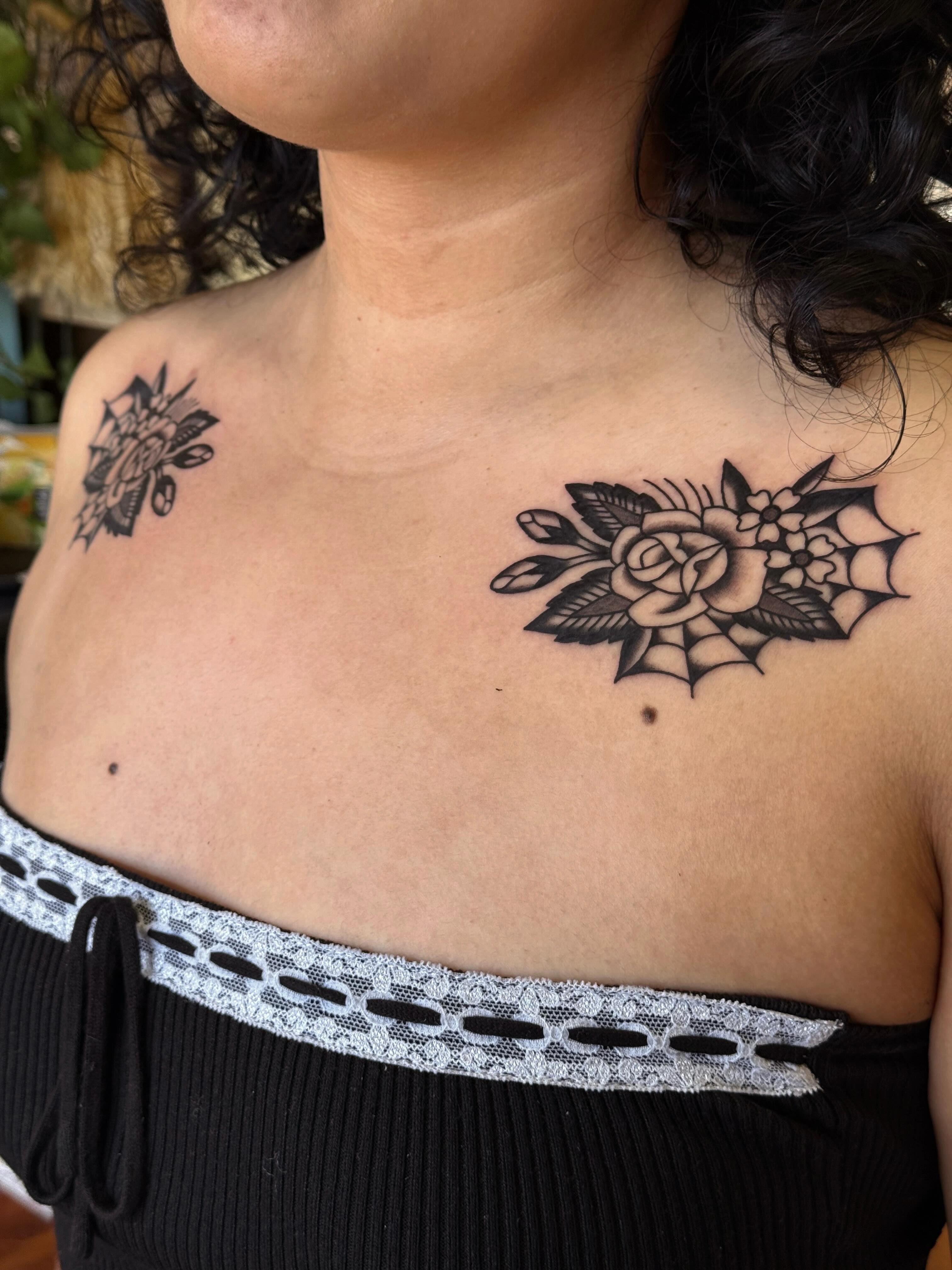 Rose and spiderweb black and grey tattoo on the chest by Bridgette Carberry