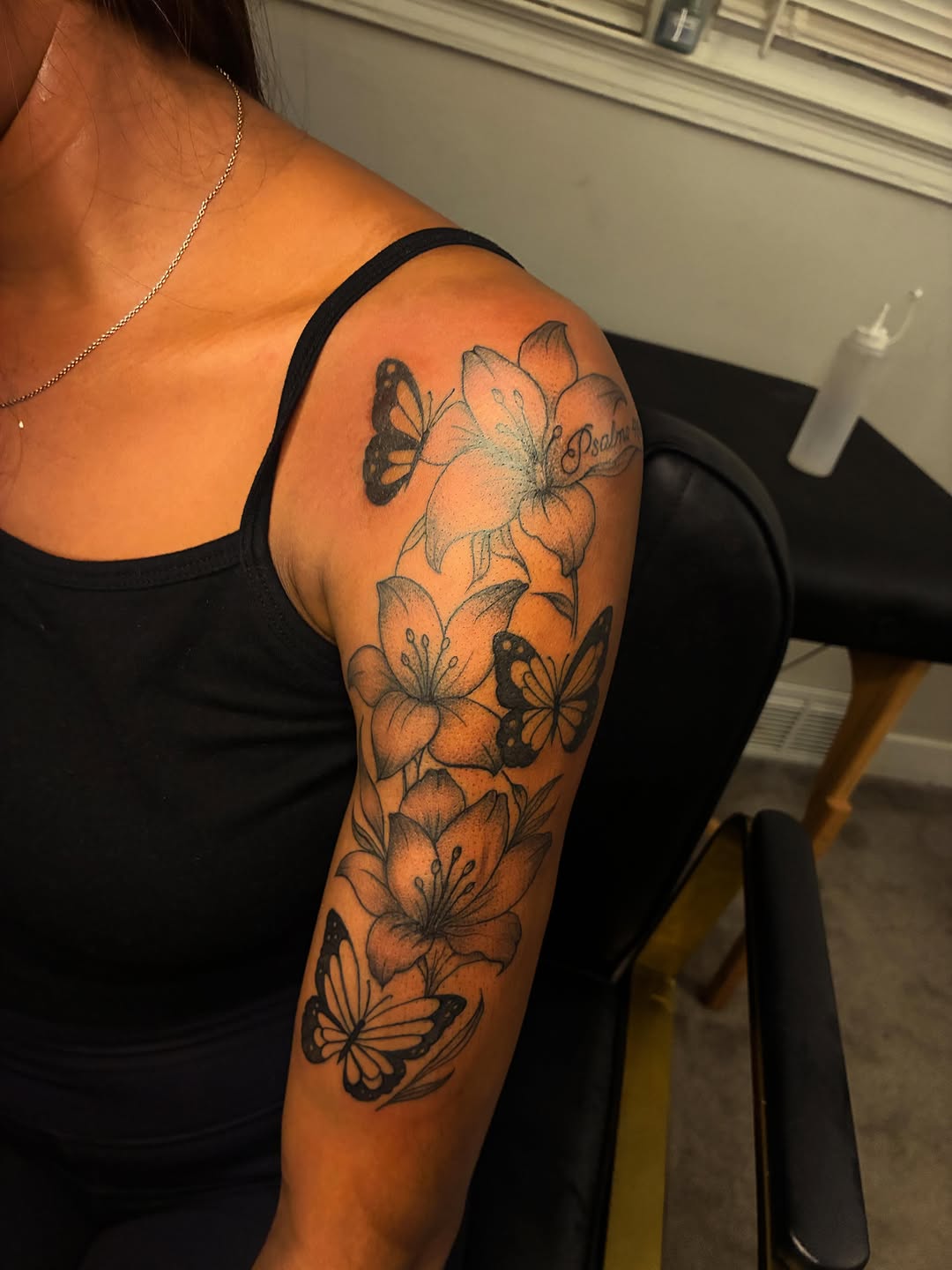 Flowers and butterflies with script fine line tattoo on the upper arm by ɪɪɴᴋᴇᴅʙʏʀᴇɴɴ🐉