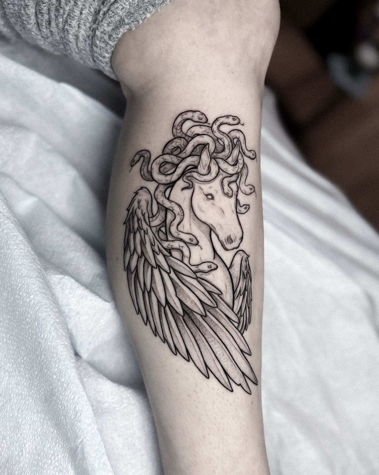 Medusa black and grey tattoo on the forearm by Whimsical Tattoos