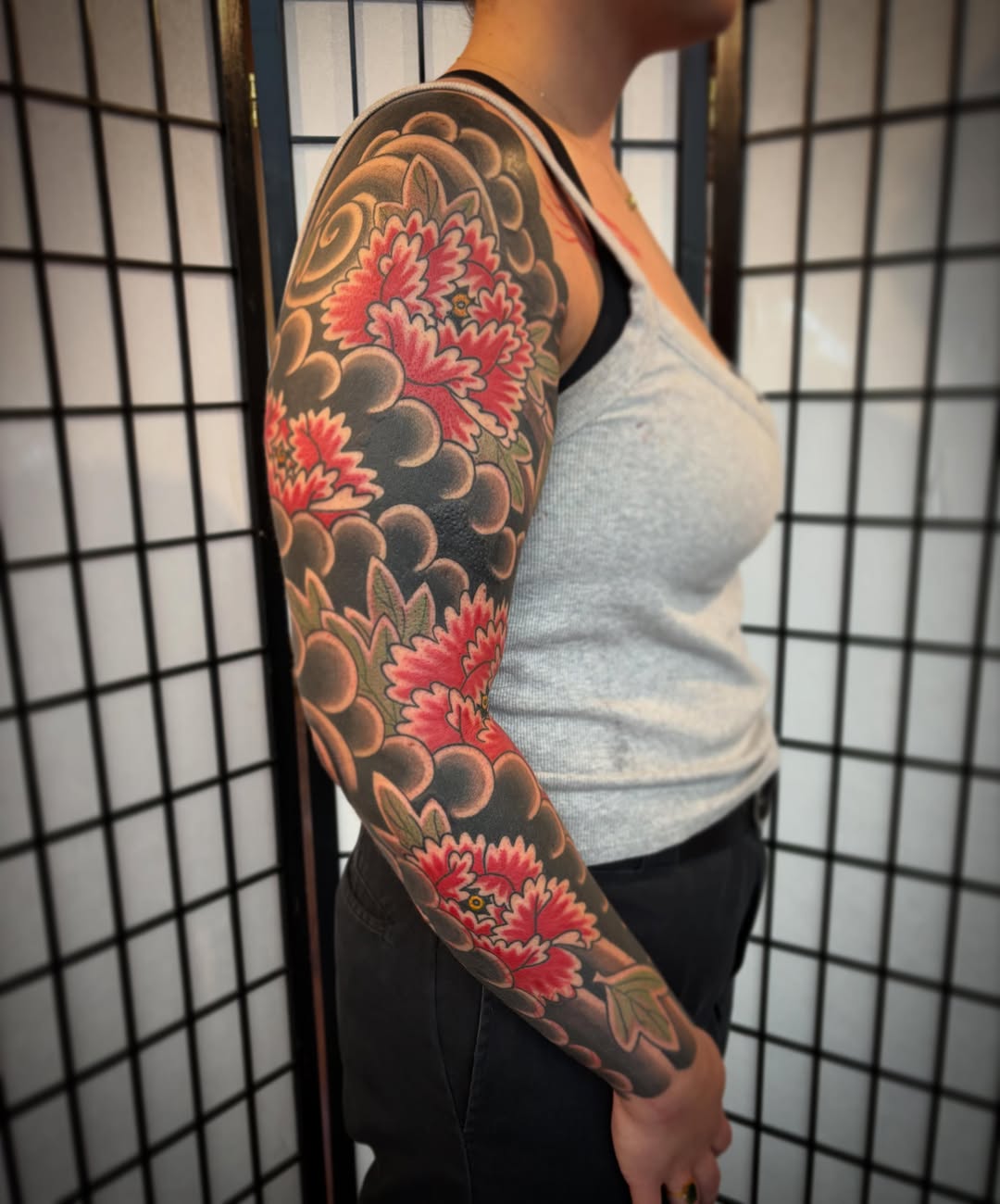 Floral bouquet japanese irezumi tattoo on the upper arm by dayton skuse, Portland, Oregon