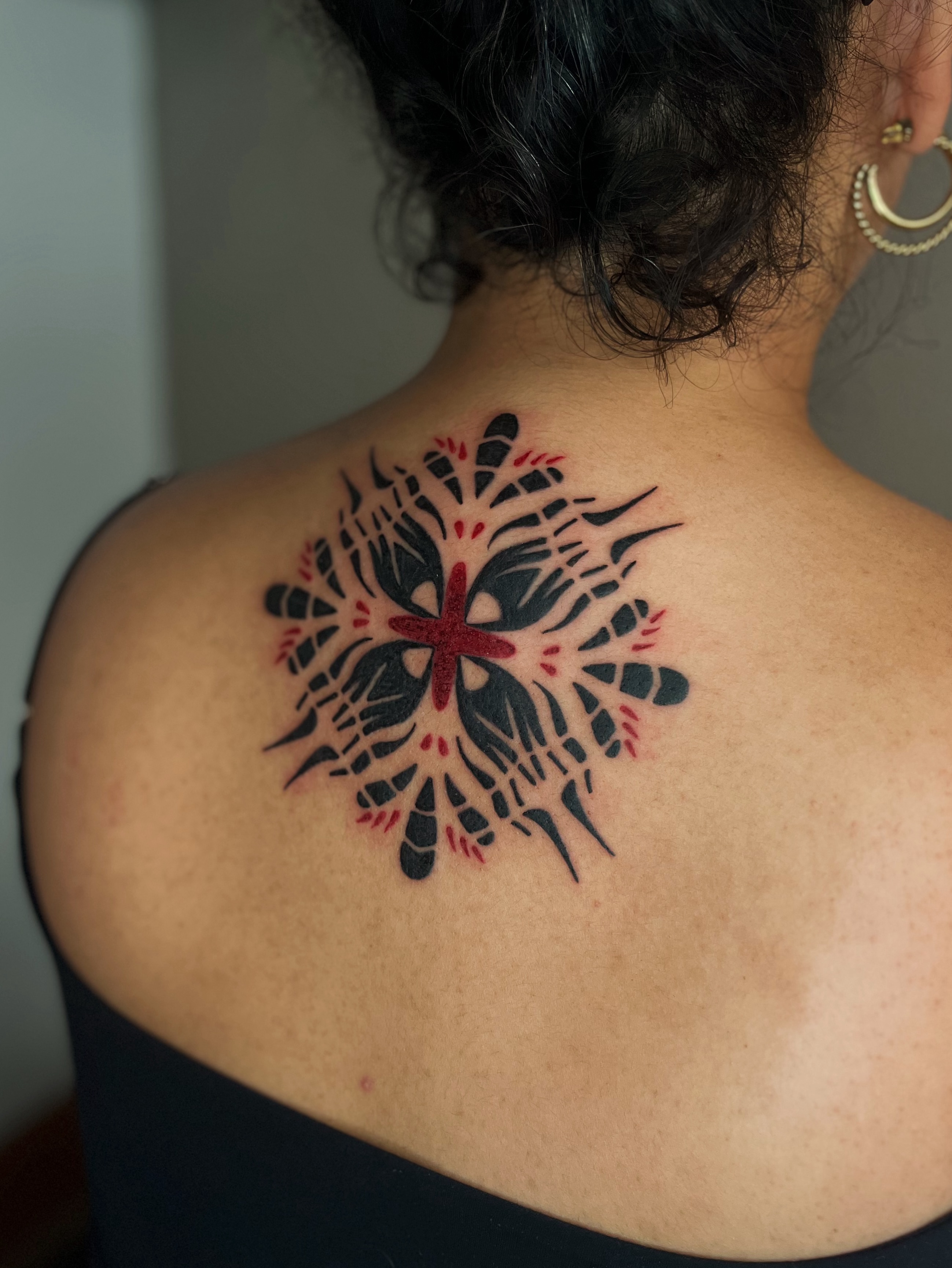Snowflake geometric tattoo on the back by Abigail, San Francisco, California