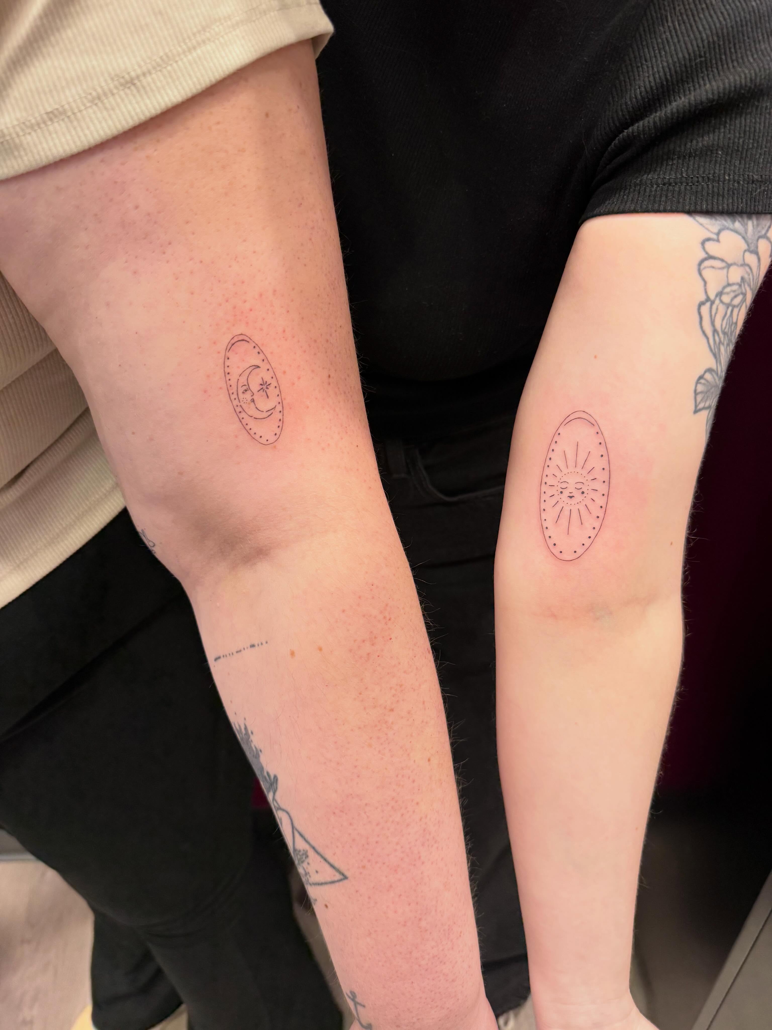 Sun and moon dotwork tattoo on the forearm by fine line tattoos