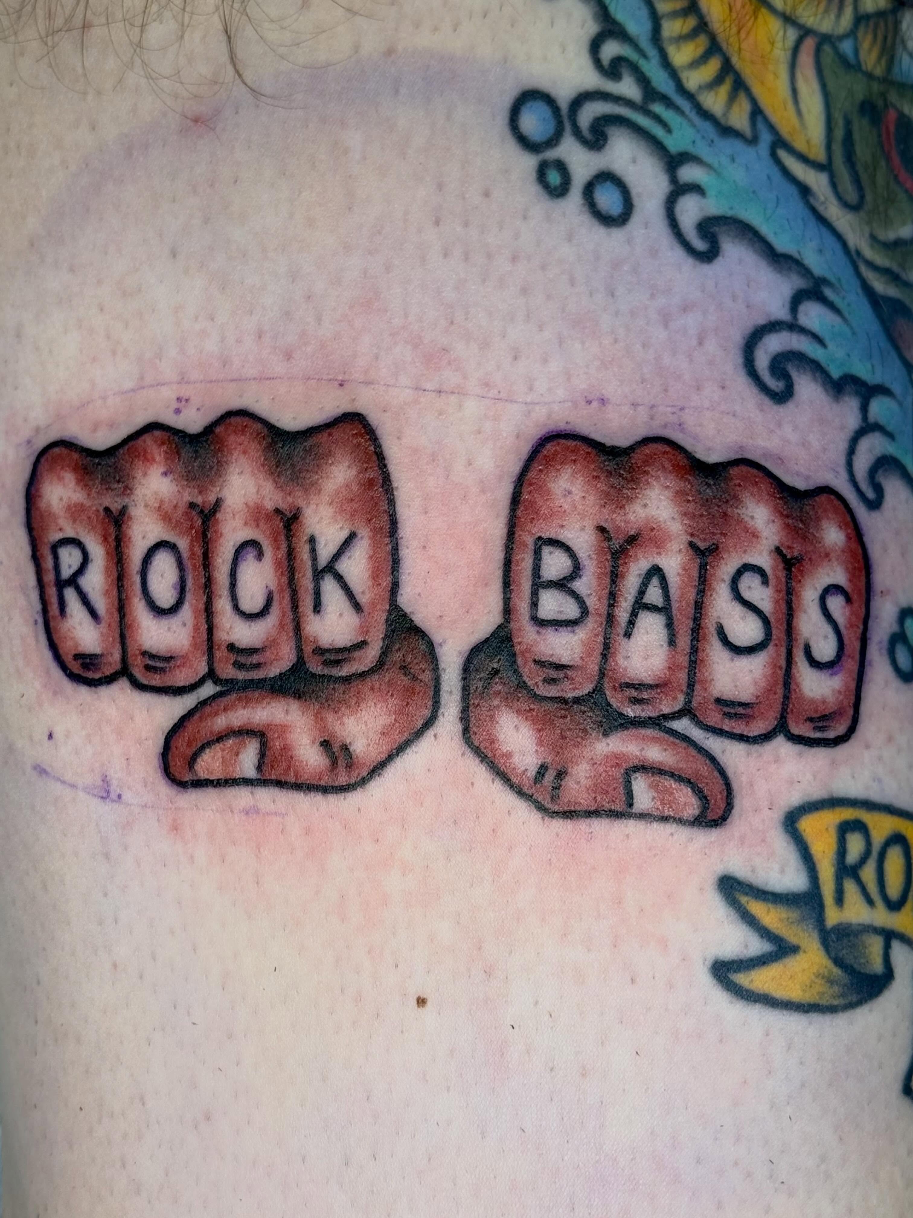 Rock and bass American traditional tattoo on the shoulder by KevinBetsch