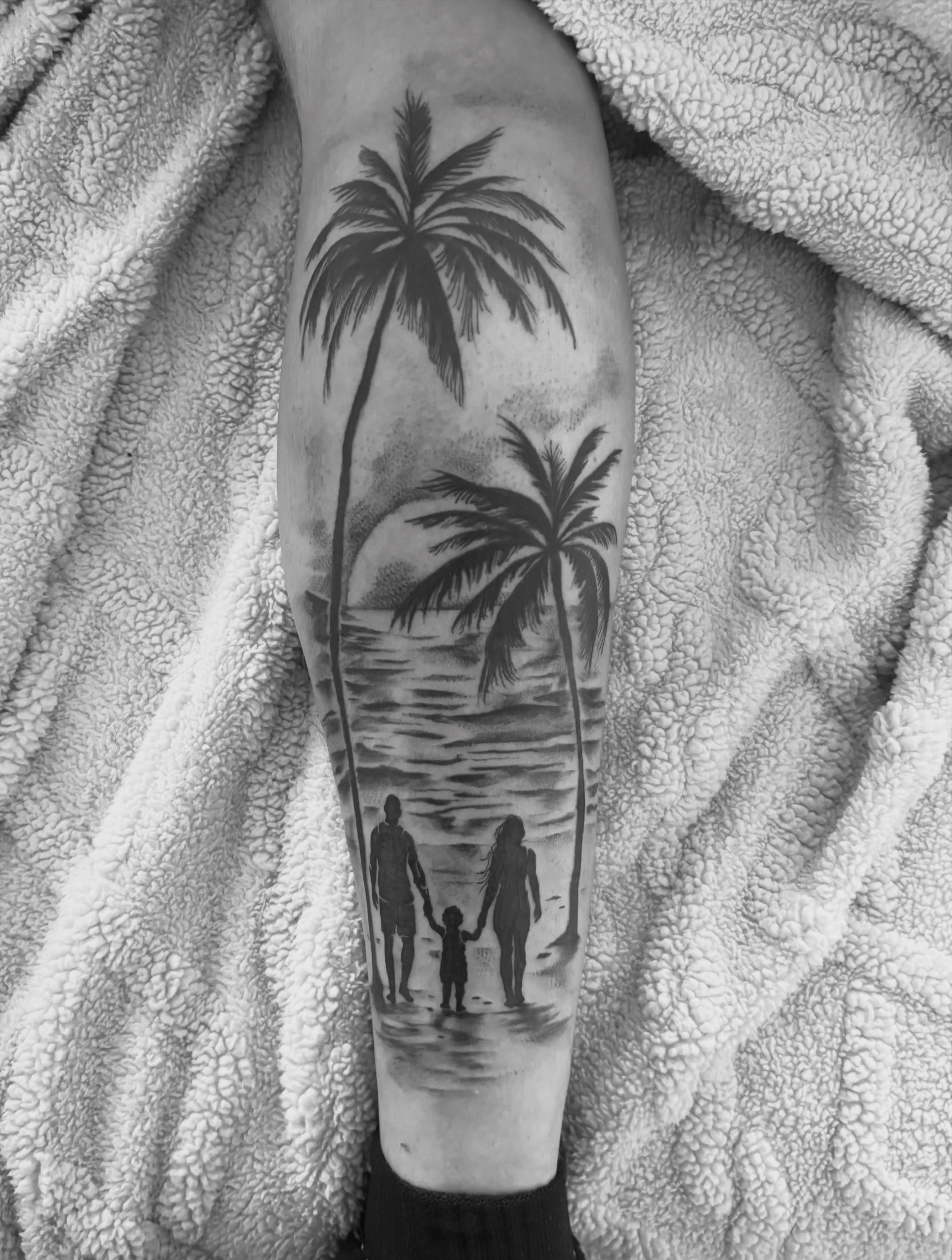 Beach family silhouette realism tattoo on the forearm by @secretlinetattoo