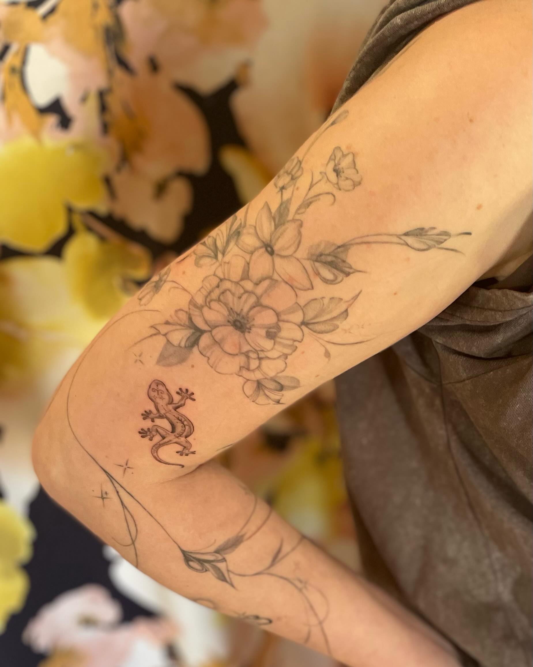 Floral bouquet with lizard black and grey tattoo on the forearm by paige  l  ink shrink tattoo