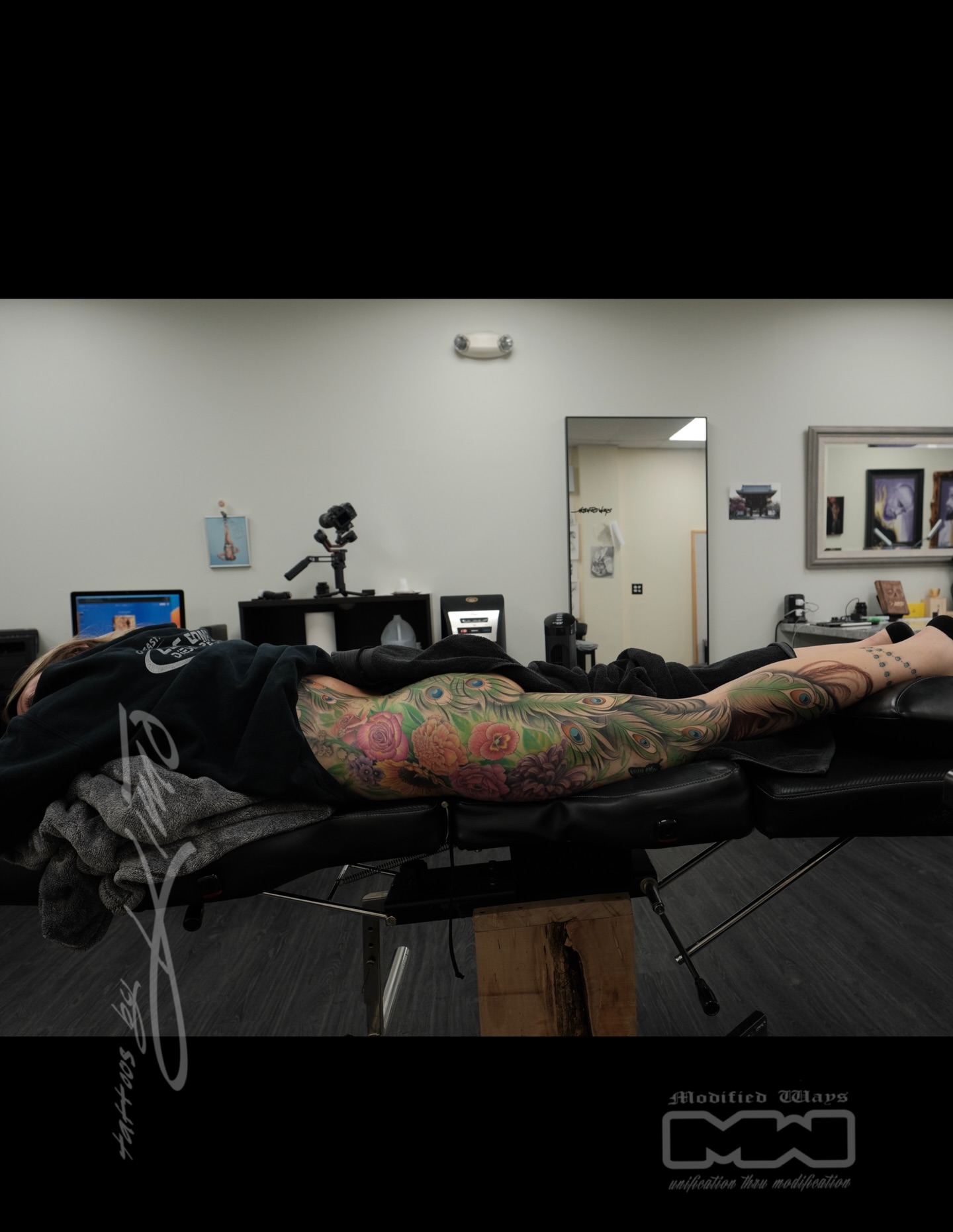 Peacock and floral American traditional tattoo on the leg by Kansas City tattoo artist