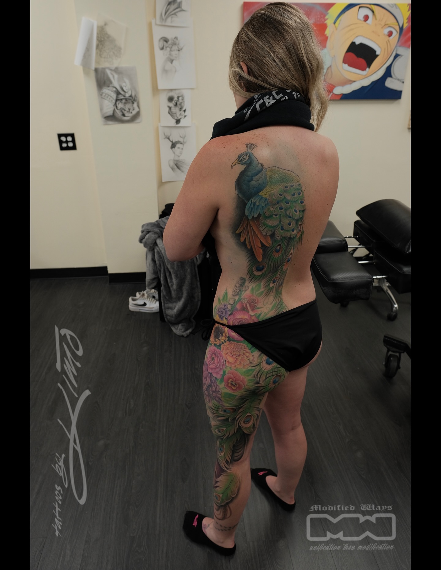 Peacock and floral new school tattoo on the back by Kansas City tattoo artist