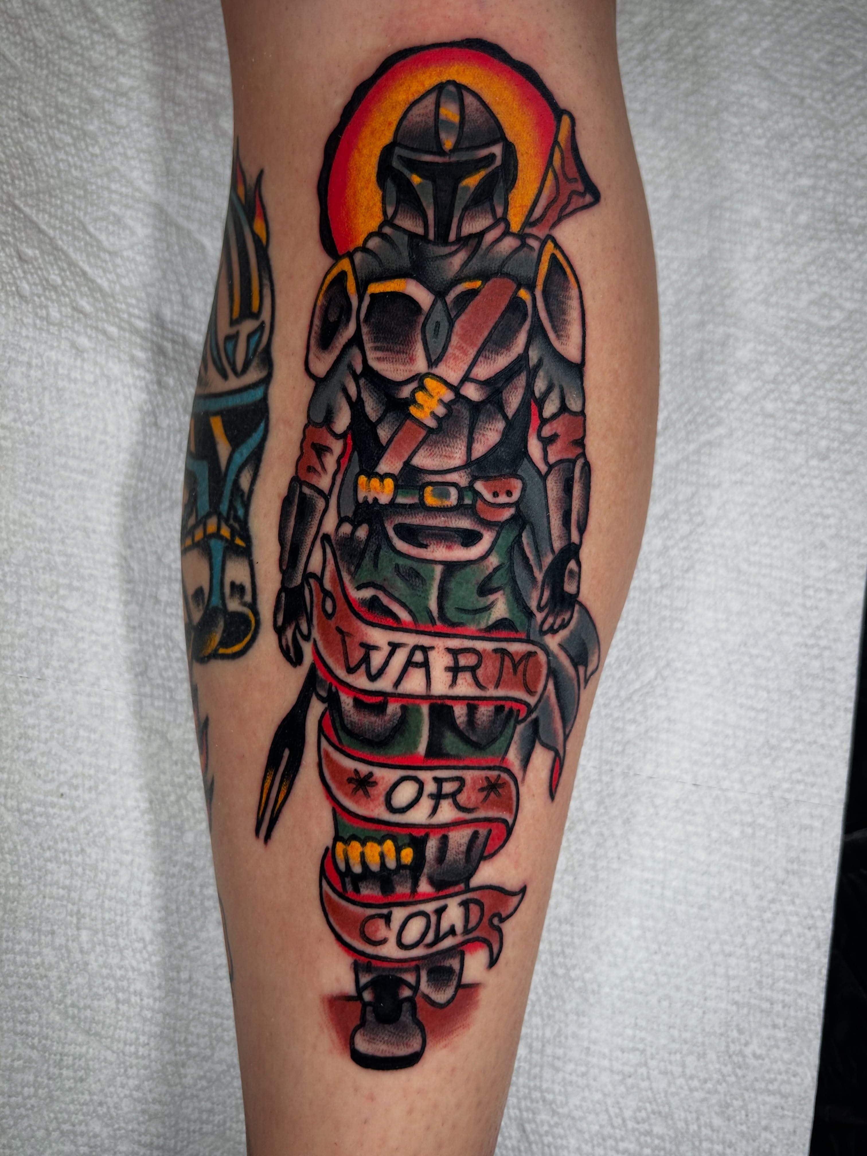 Mandalorian character American traditional tattoo on the forearm by Kit Miller, Indianapolis, Indiana