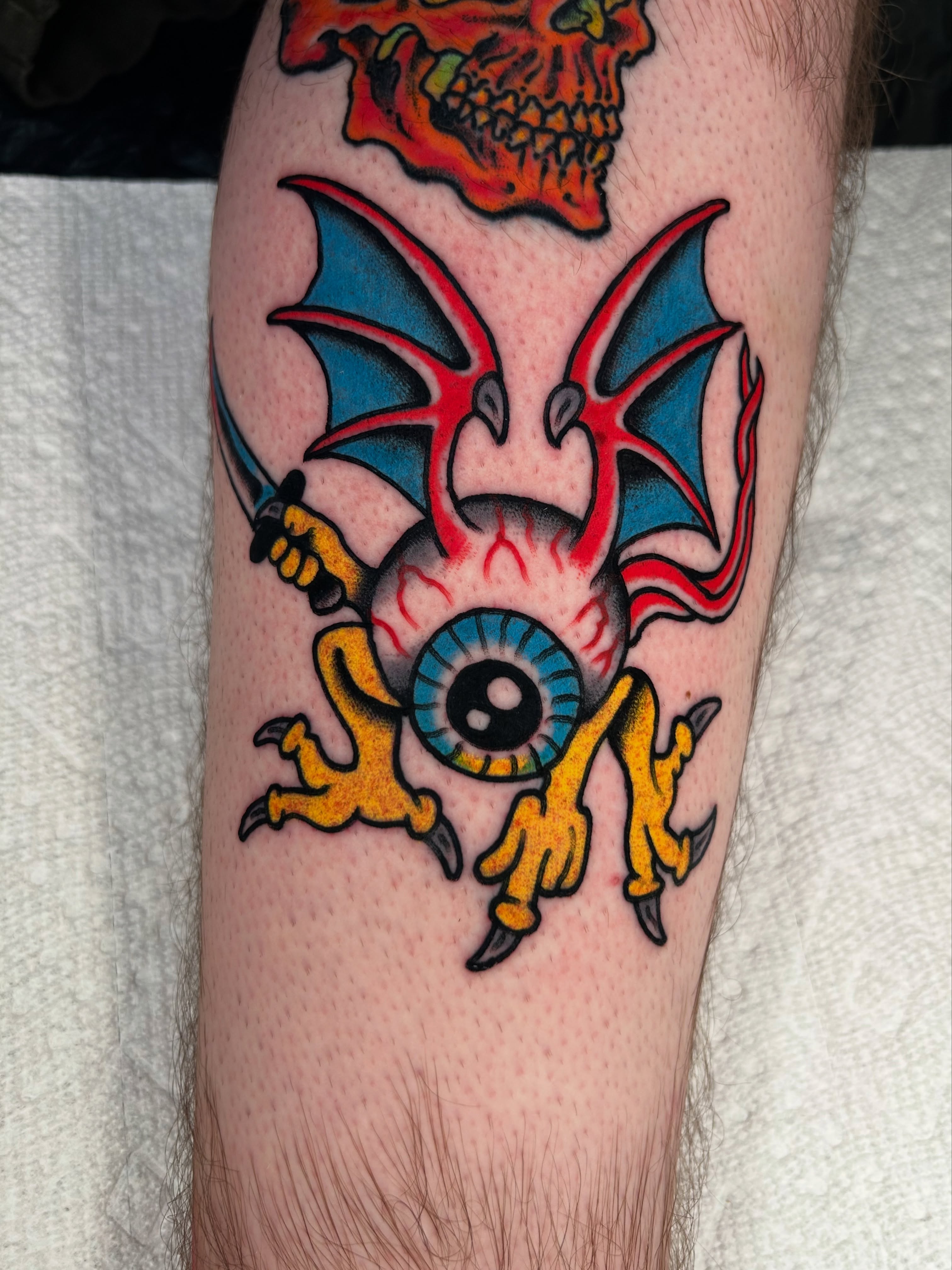 Bat and eyeball American traditional tattoo on the forearm by Kit Miller, Indianapolis, Indiana