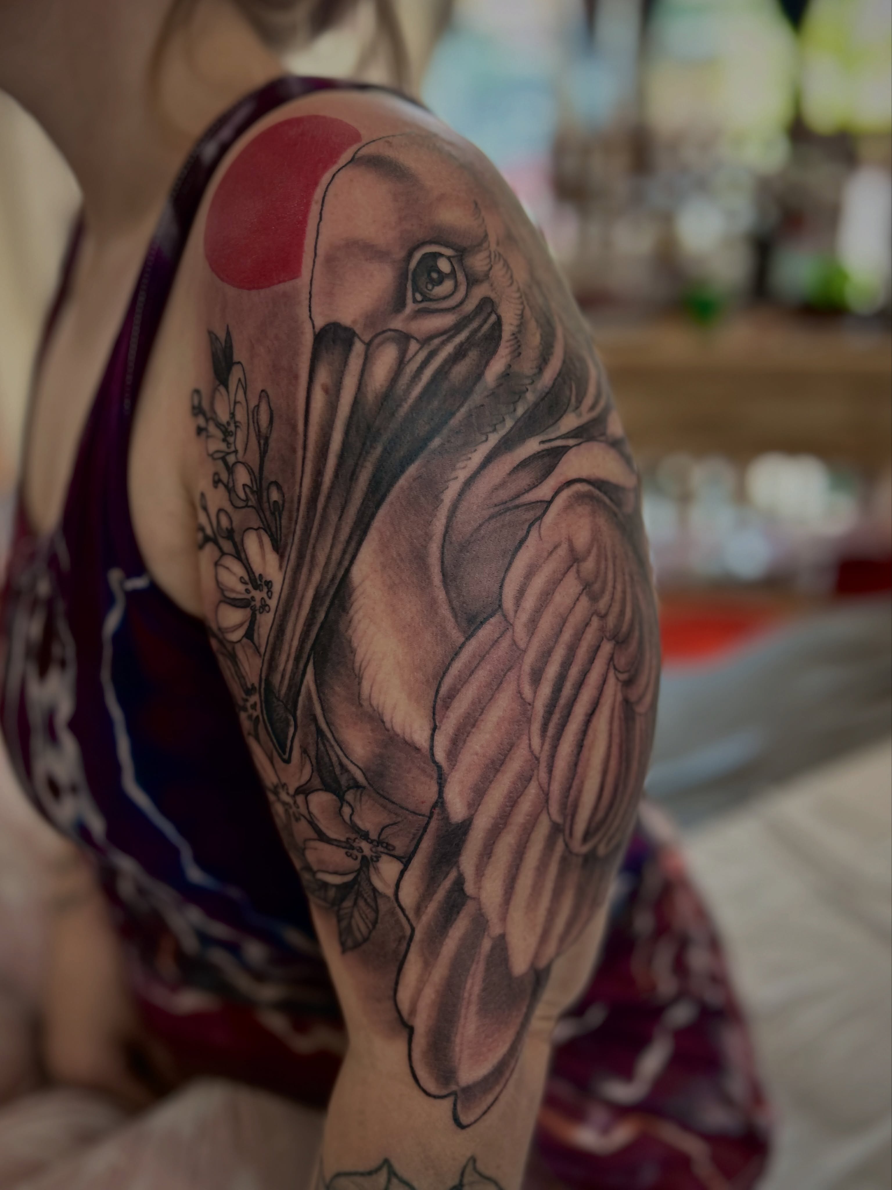 Pelican realism tattoo on the upper arm by Ryan Willard, Denver, Colorado