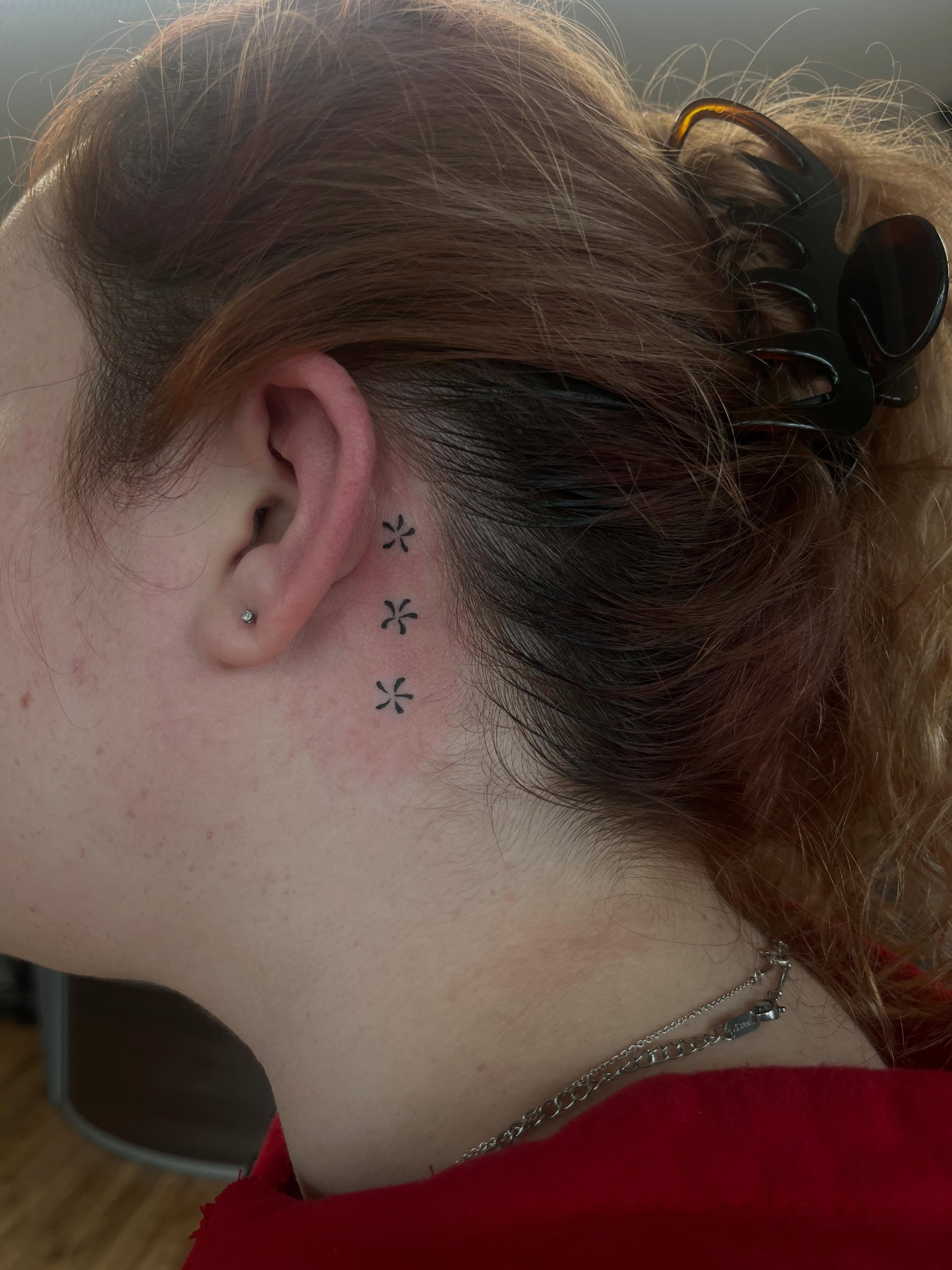 Flower dotwork tattoo on the neck by Cass