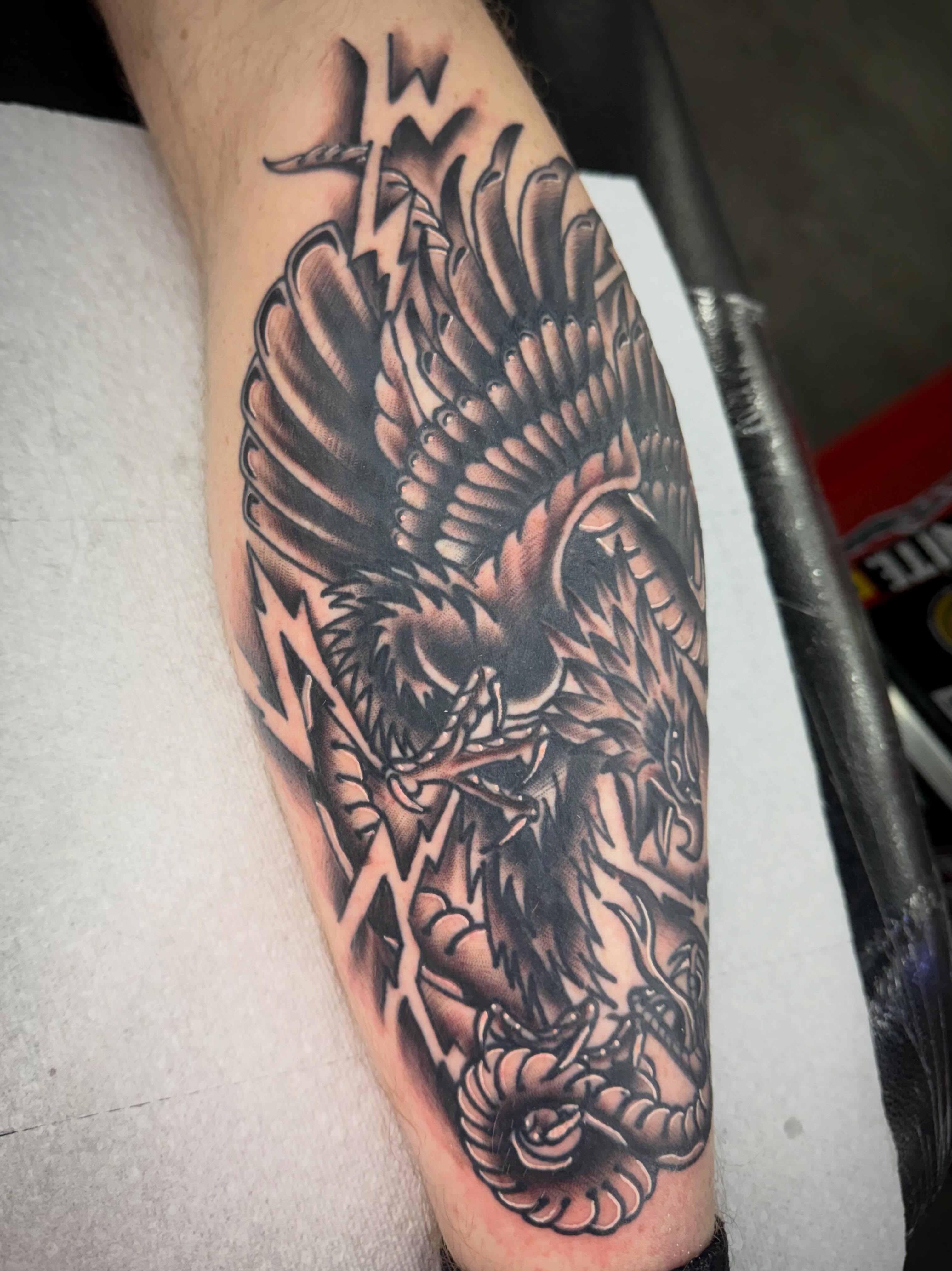 Eagle black and grey tattoo on the forearm by Jake Horstman, Dayton, Ohio
