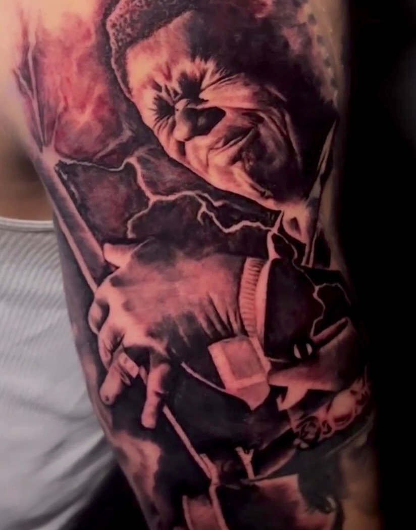 Clown realism tattoo on the forearm by Ray Wiggins