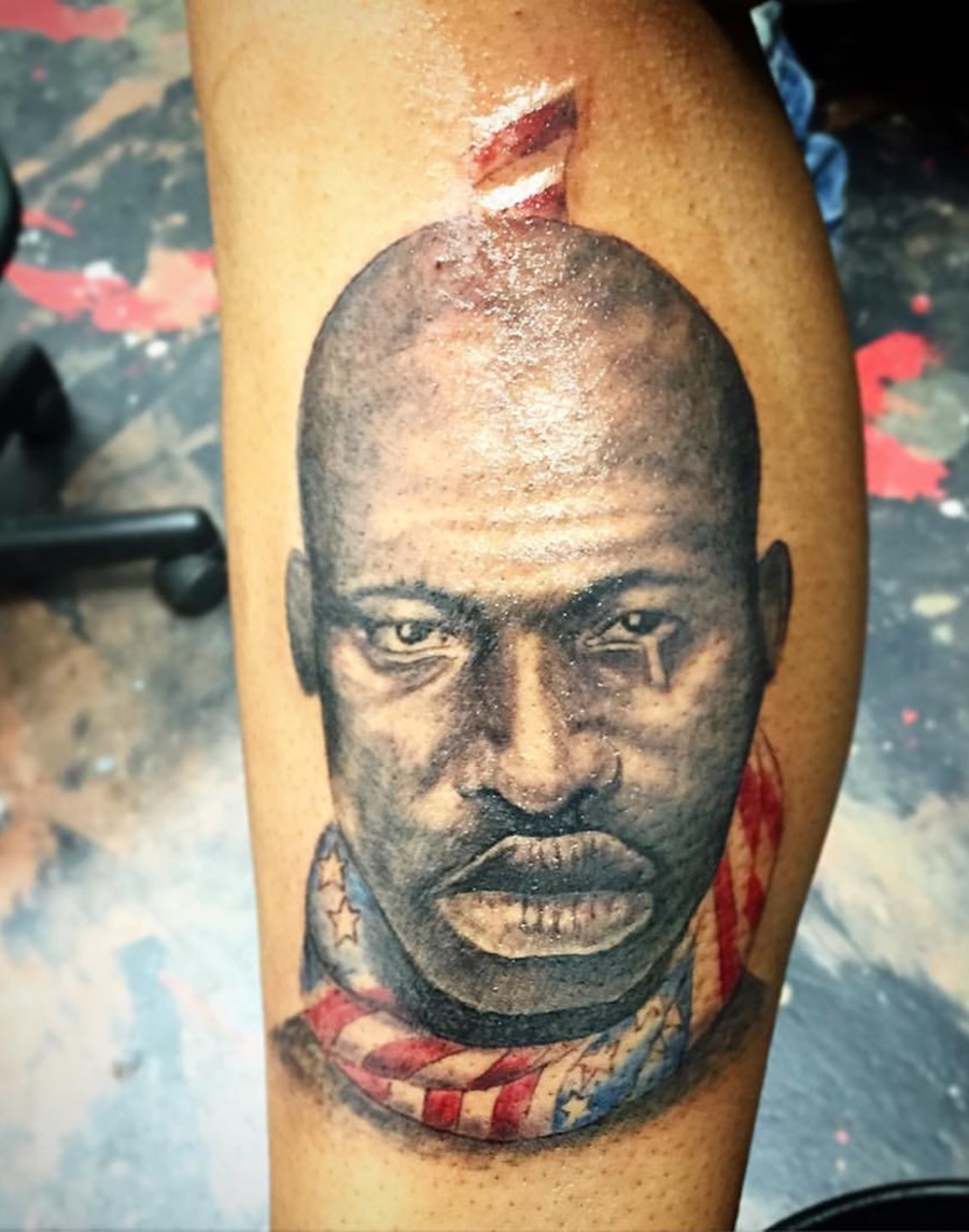 Portrait realism tattoo on the forearm by Ray Wiggins