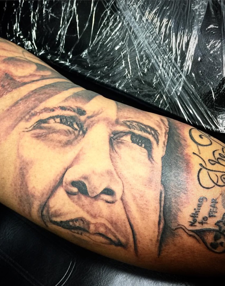 Portrait realism tattoo on the forearm by Ray Wiggins