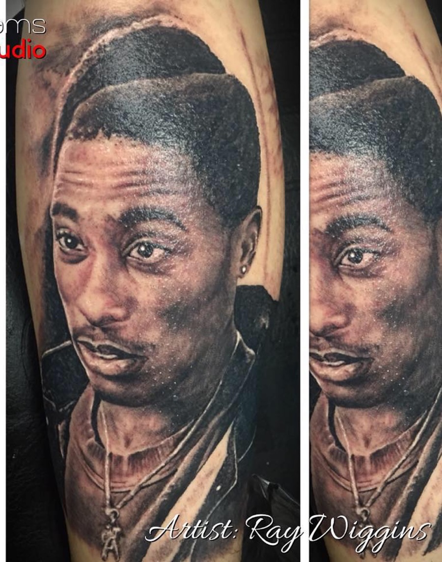 Portrait realism tattoo on the forearm by Ray Wiggins
