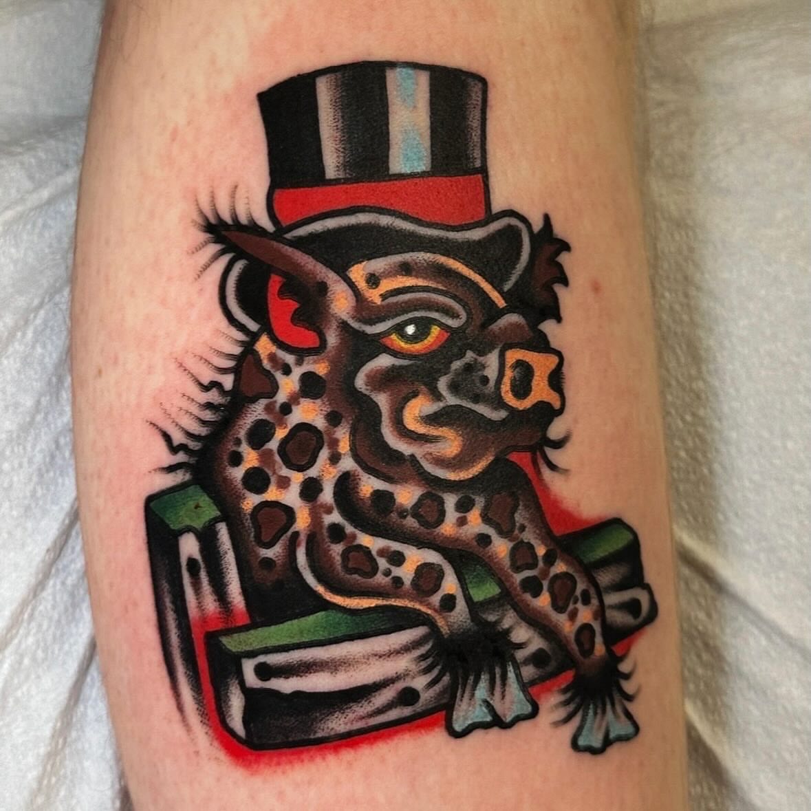 Jaguar wearing top hat American traditional tattoo on the forearm by Jared Allen, Saint Petersburg, Florida