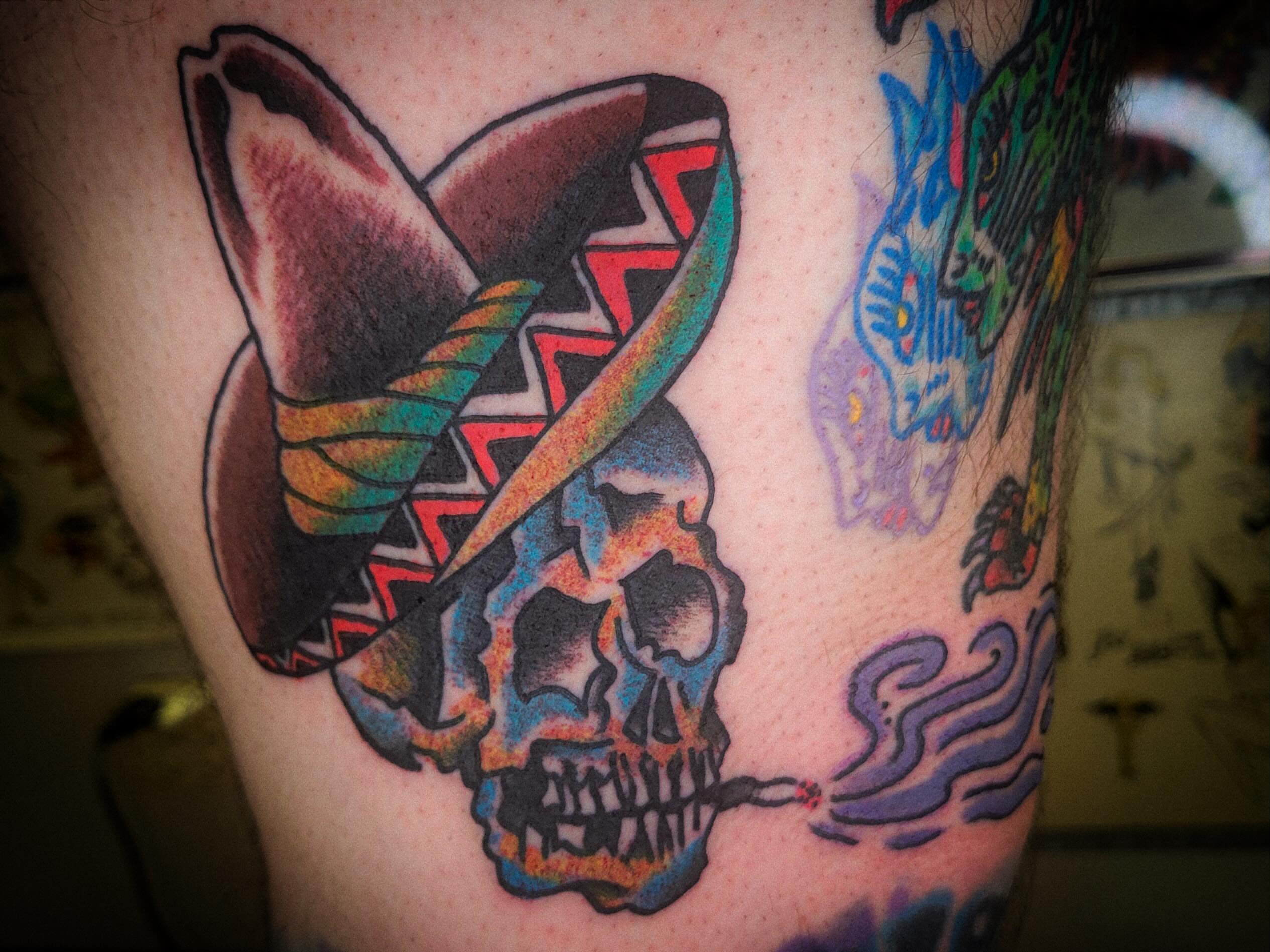 Skull wearing sombrero Chicano tattoo on the thigh by joe martinez, Denver, Colorado