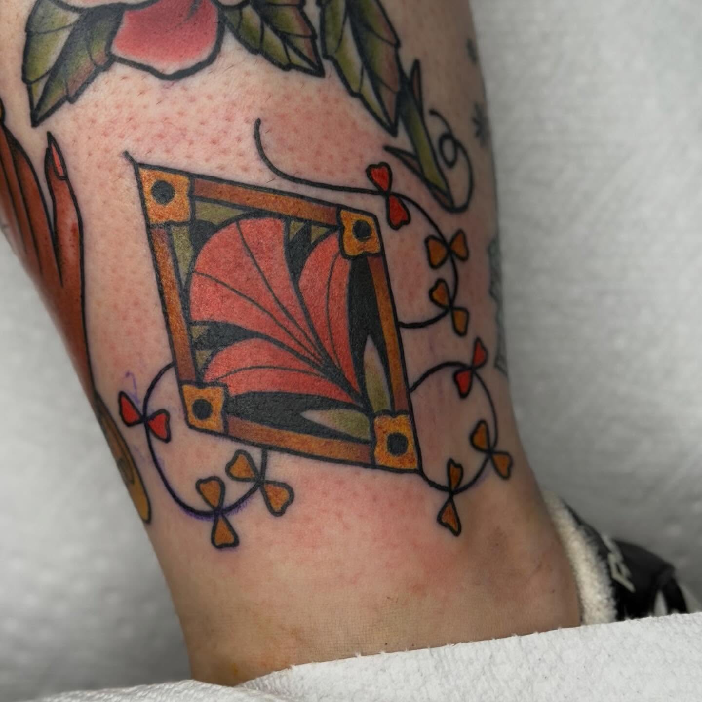 Stained glass window American traditional tattoo on the forearm by Jenna Szerszen-Wynn ๐