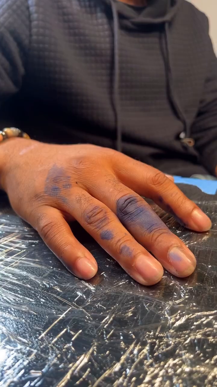 A woman tattooing a man's hand tattoo on the chest by ★𝐑𝐮𝐞★