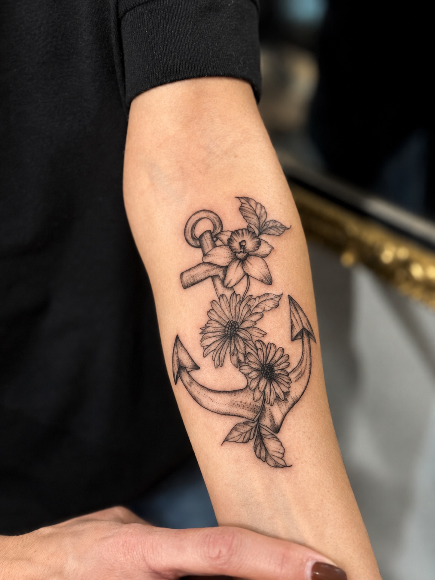 Anchor with flowers black and grey tattoo on the forearm by JAmy Winters