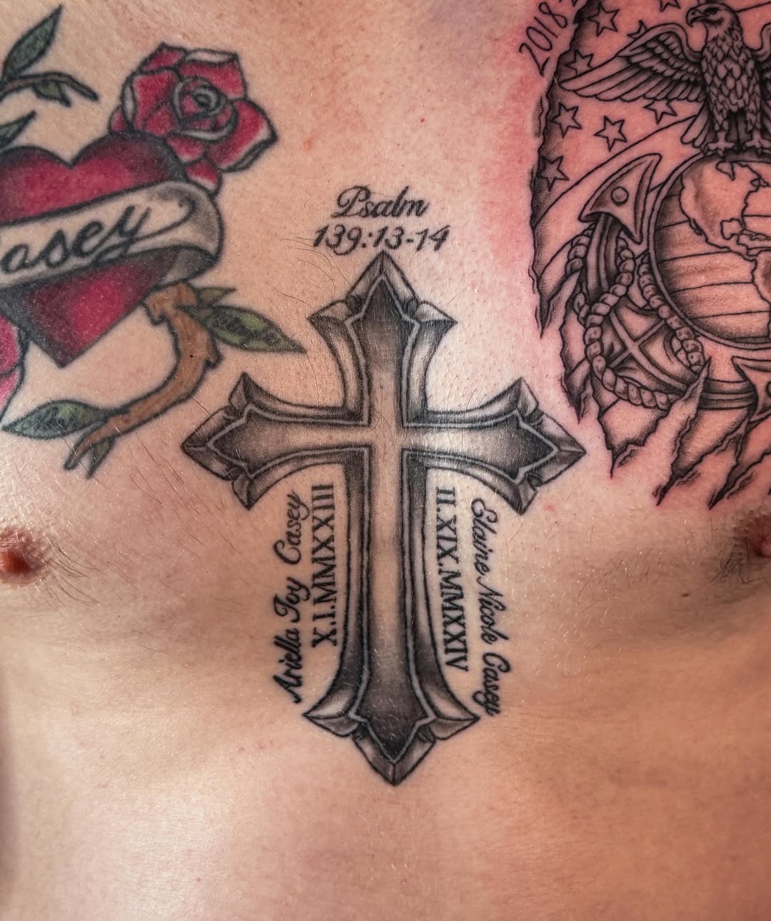 Cross with scripture black and grey tattoo on the chest by Ash✨