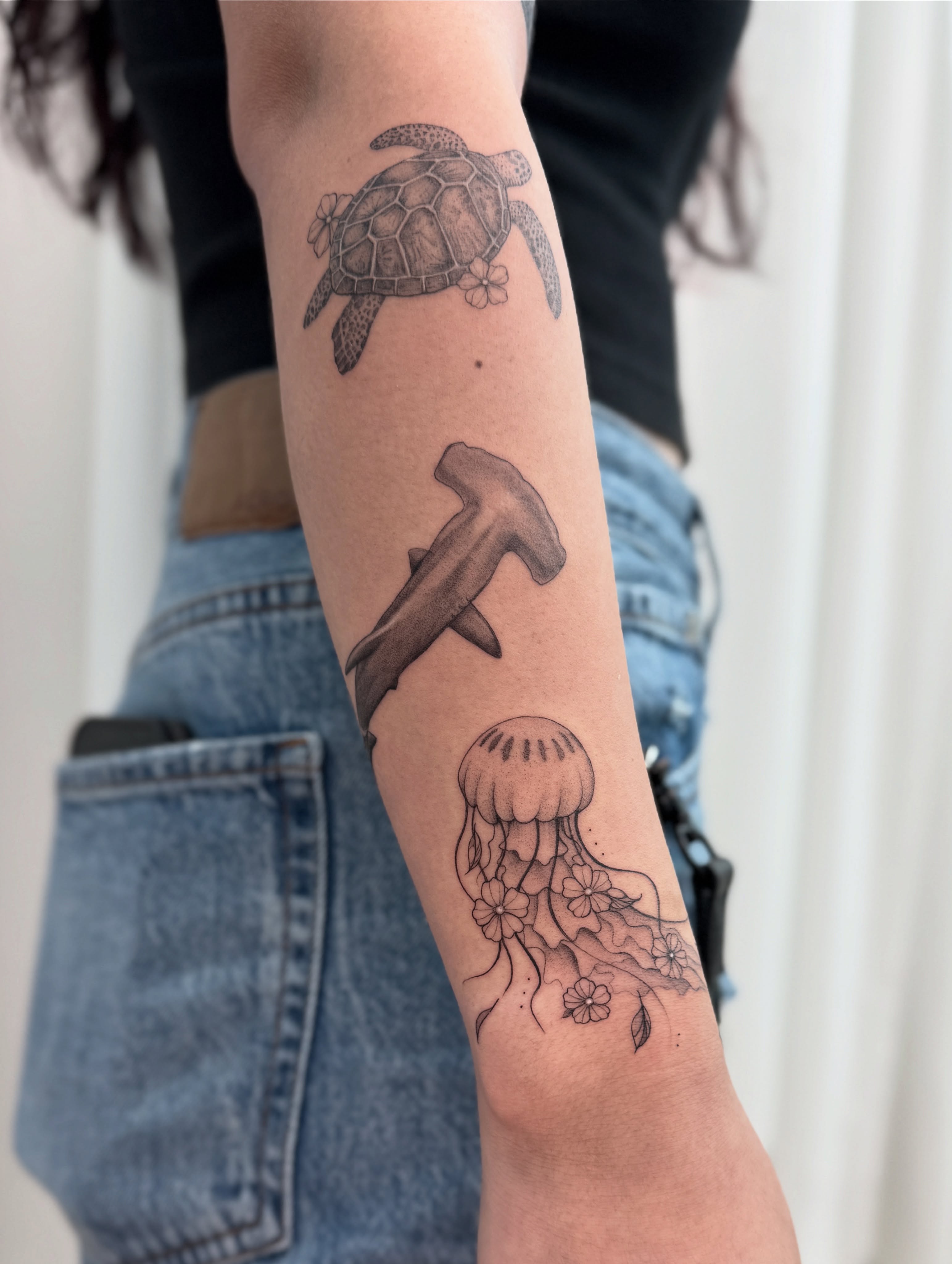Sea creatures black and grey tattoo on the forearm by Jasmine, Lynnwood, Washington