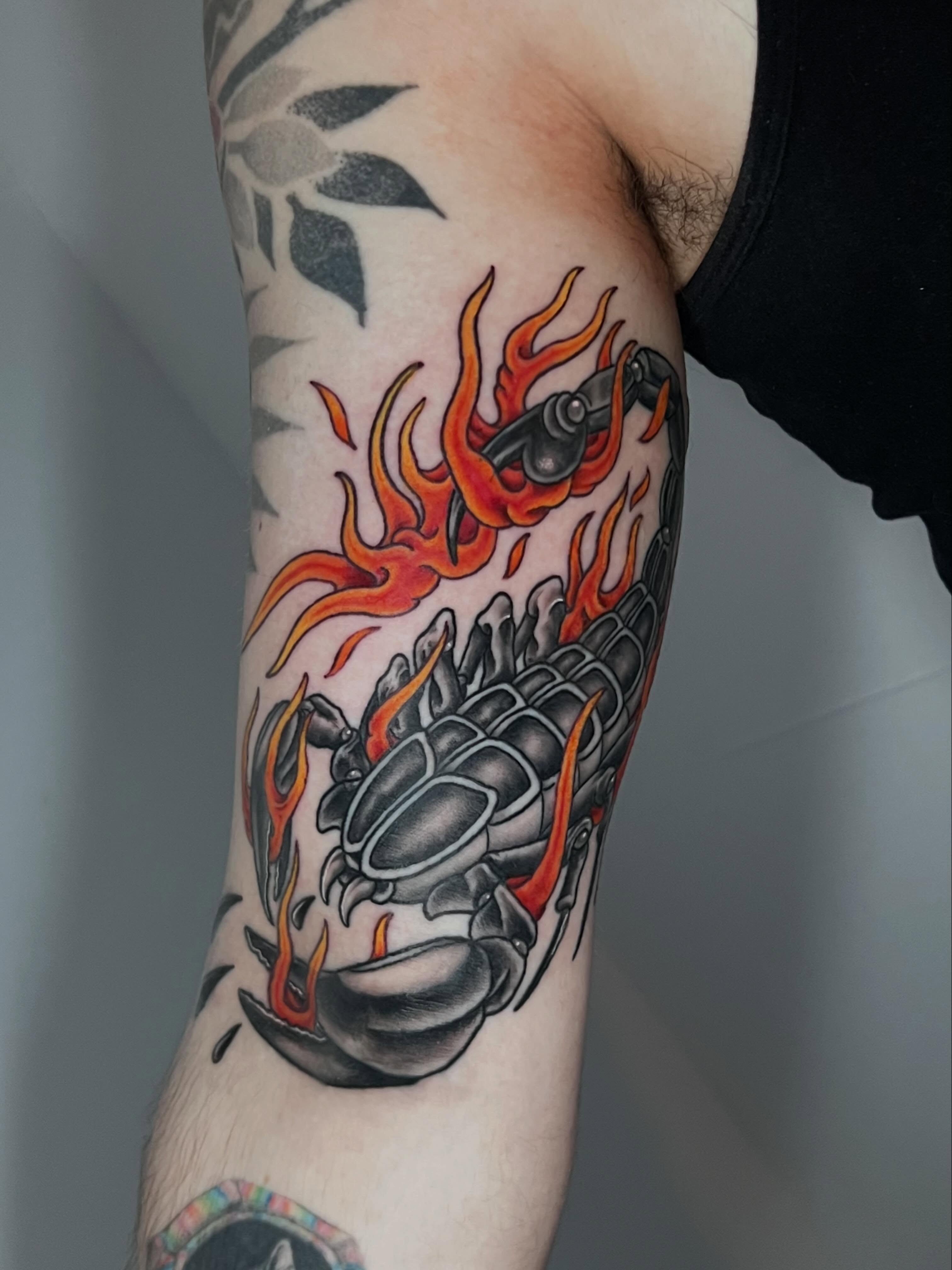Grenade with flames neo-traditional tattoo on the forearm by Eoghann McGregor